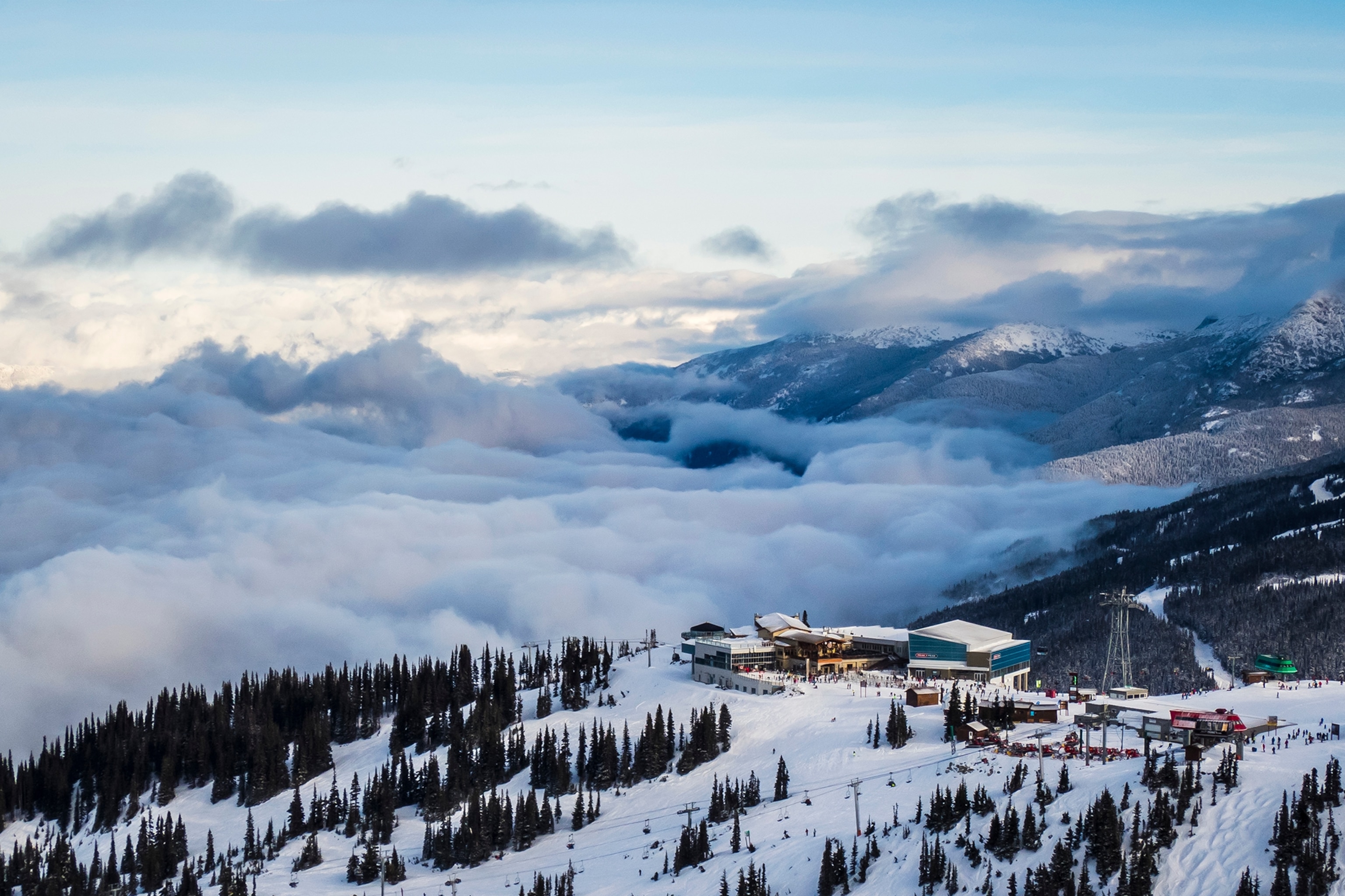An epic snowy mountain valley from the bird's-eye perspective.
