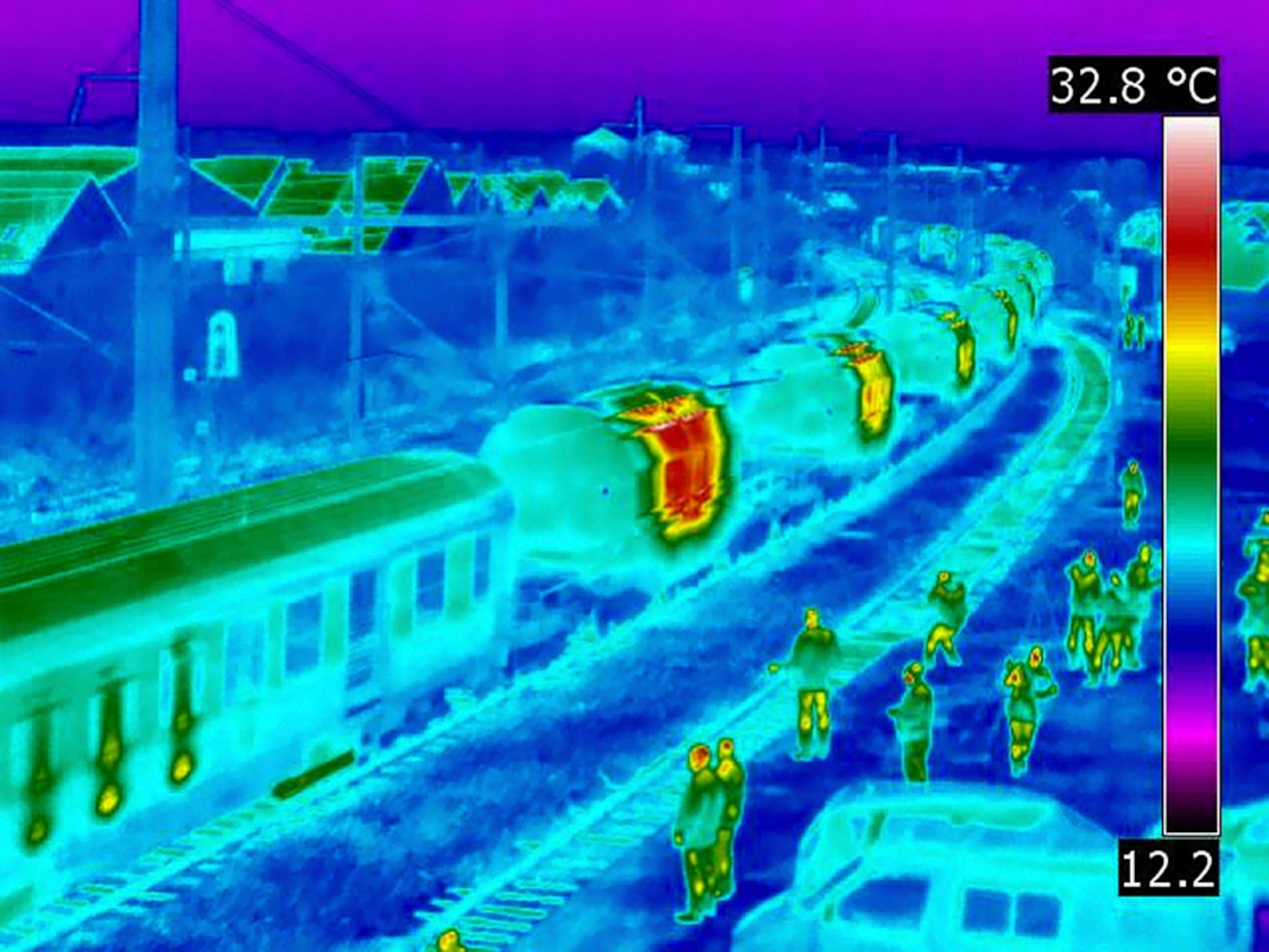 Railroad cars glow red in a thermal image of a train carrying nuclear waste (picture)