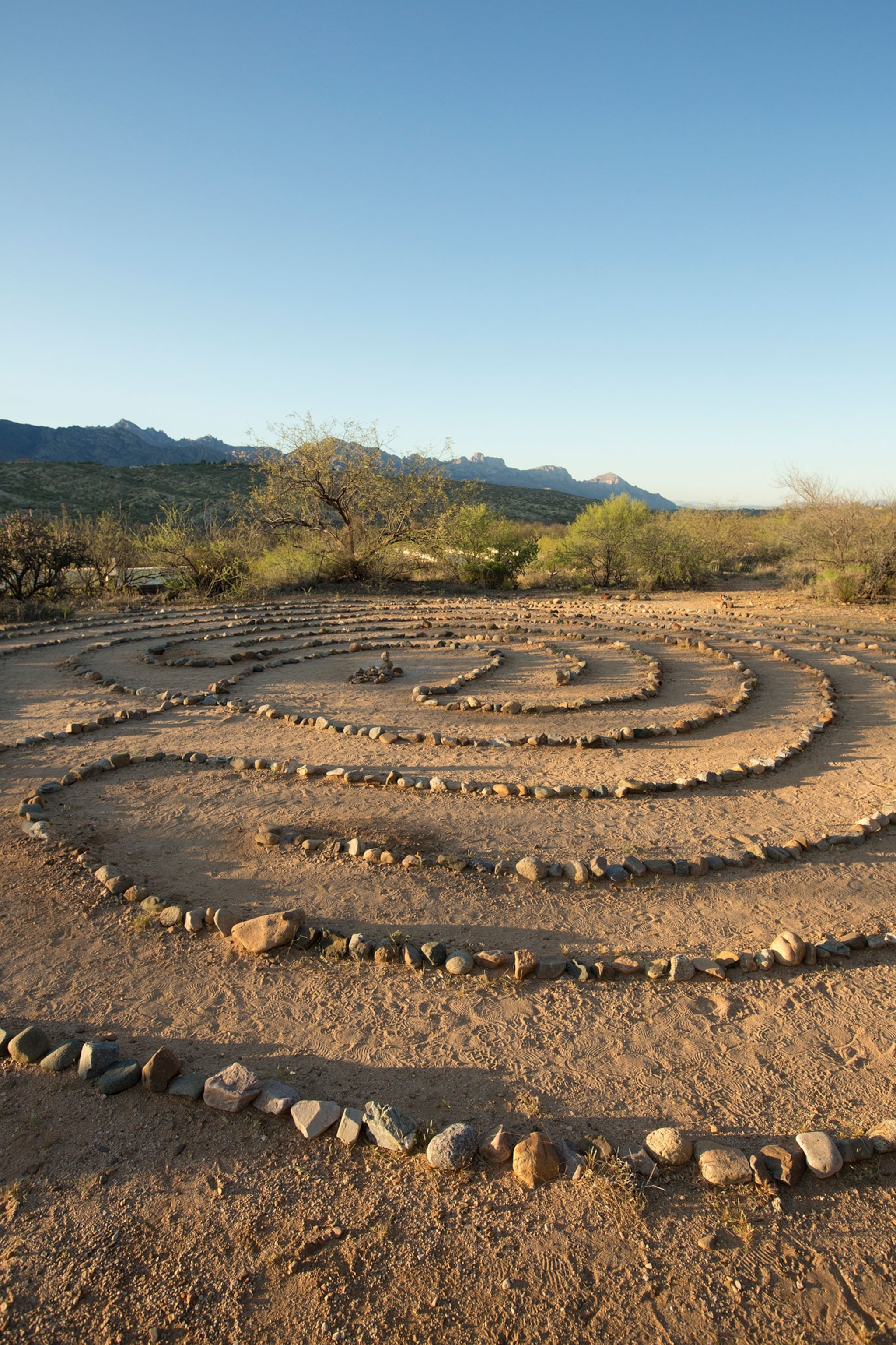 Stones make a swirling pattern under a blue sky