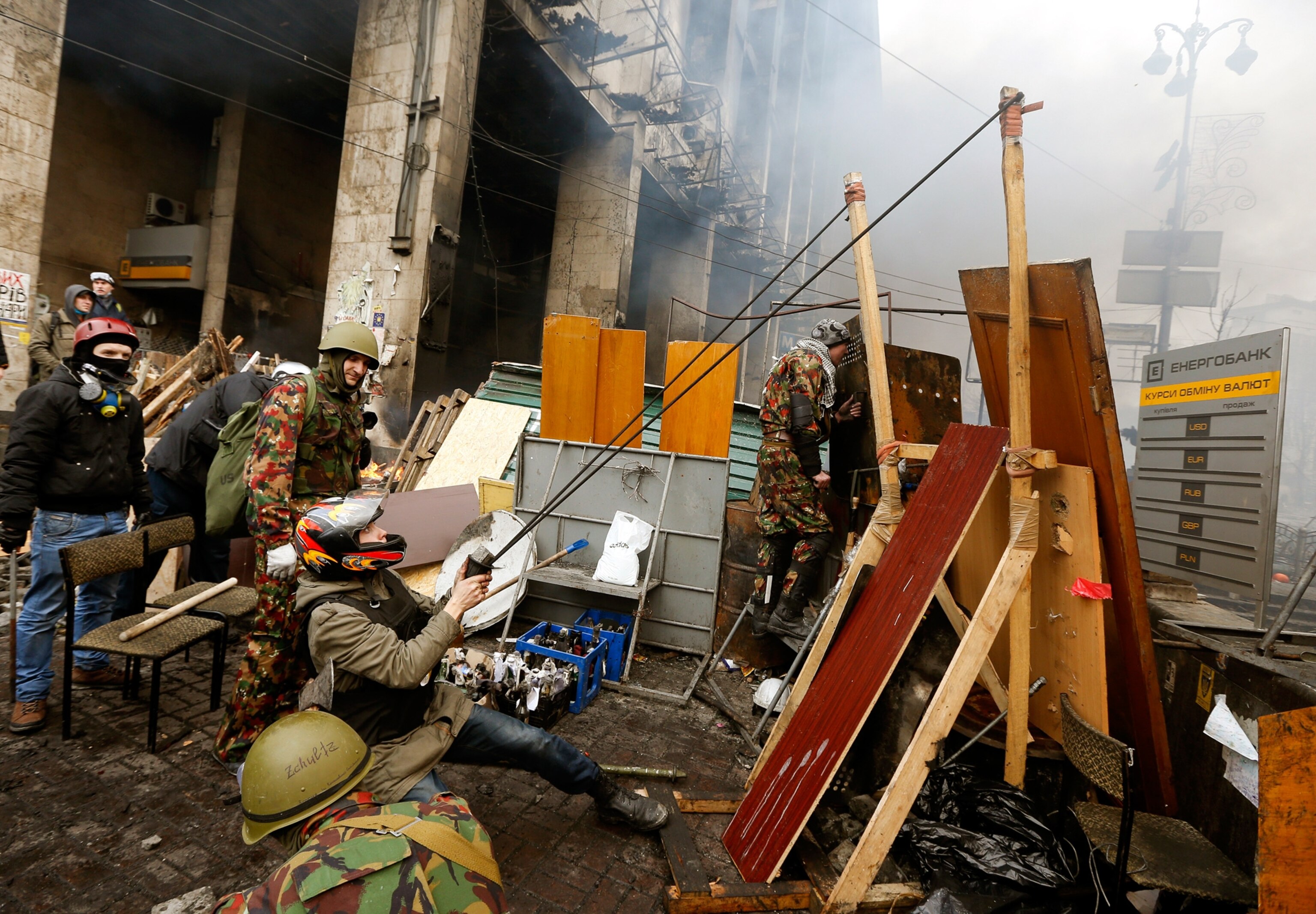 Anti-government protesters clash with riot police.