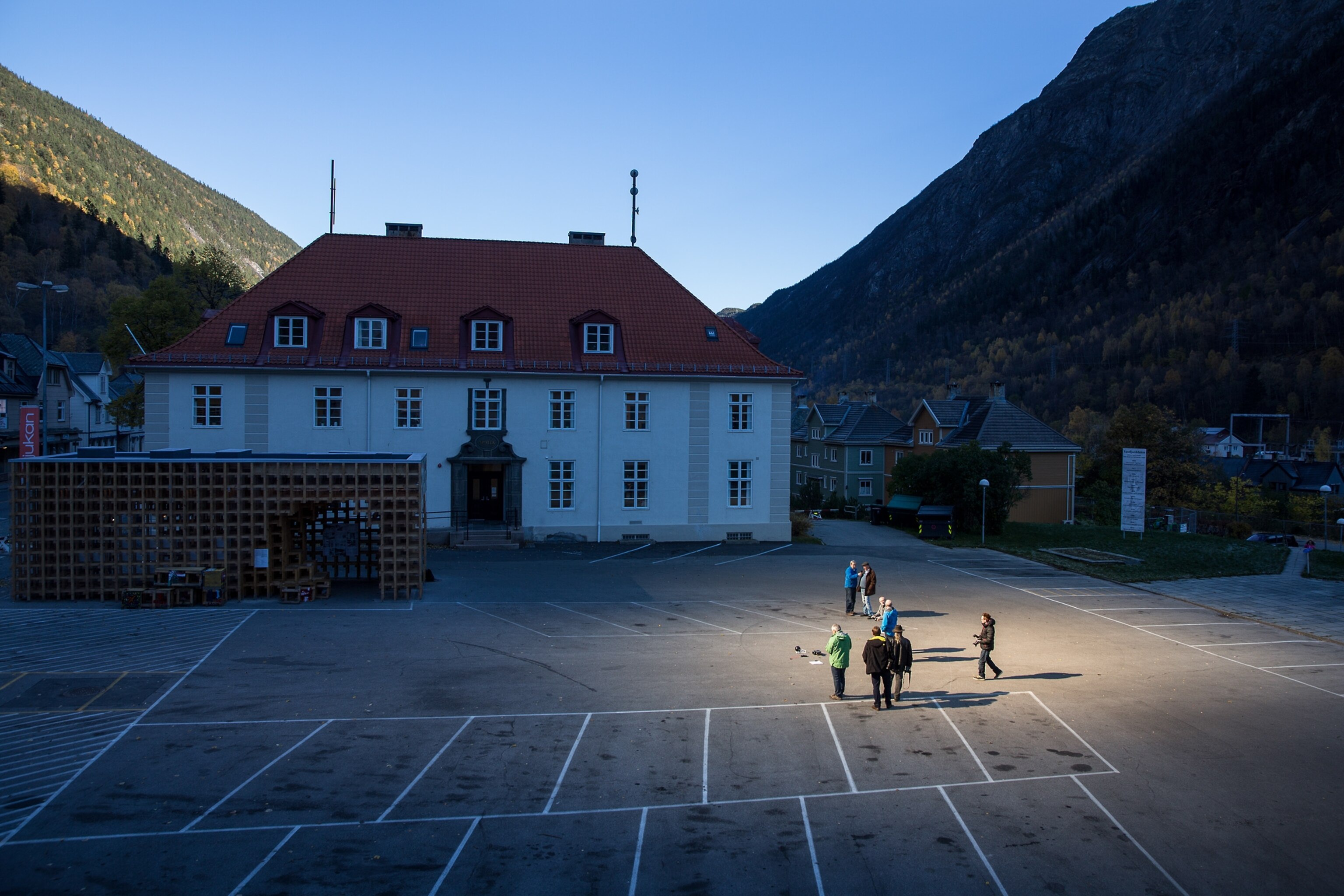 people gathered in light spot reflected from mirror in Rjukan, Norway