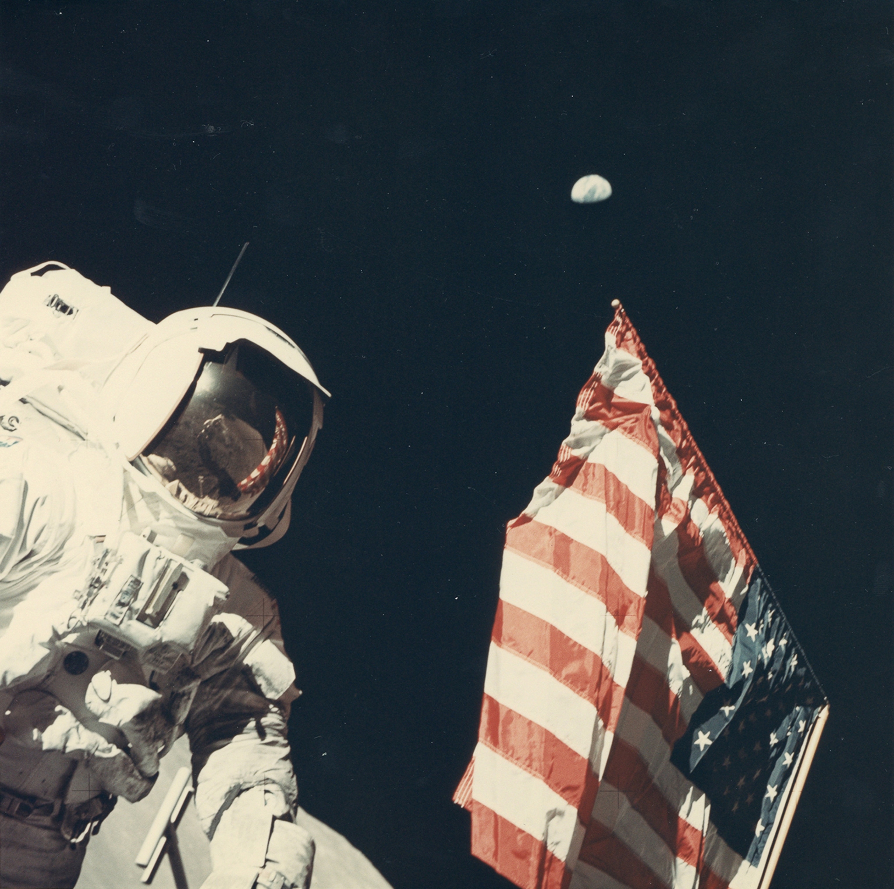 Harrison Schmitt on the moon with the American flag