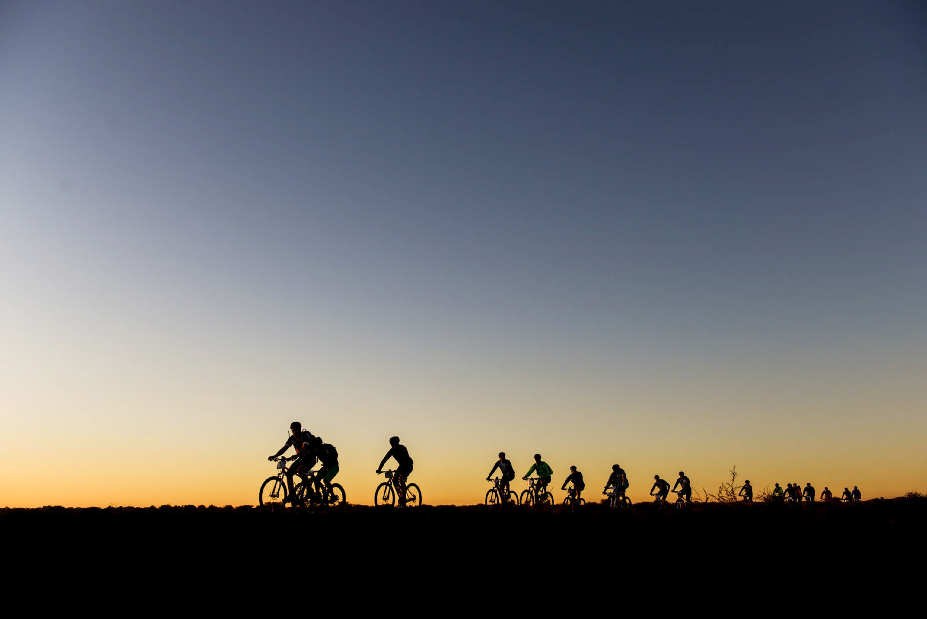 bikers at sunrise during Tour de Tuli in southern Africa