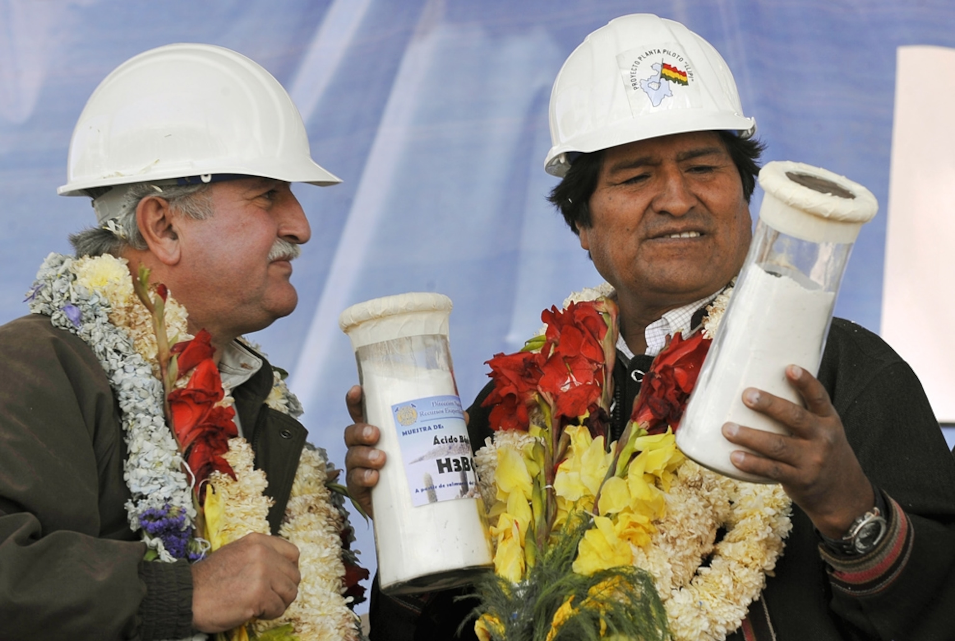 Bolivian President Evo Morales receives the first laboratory samples of lithium carbonate