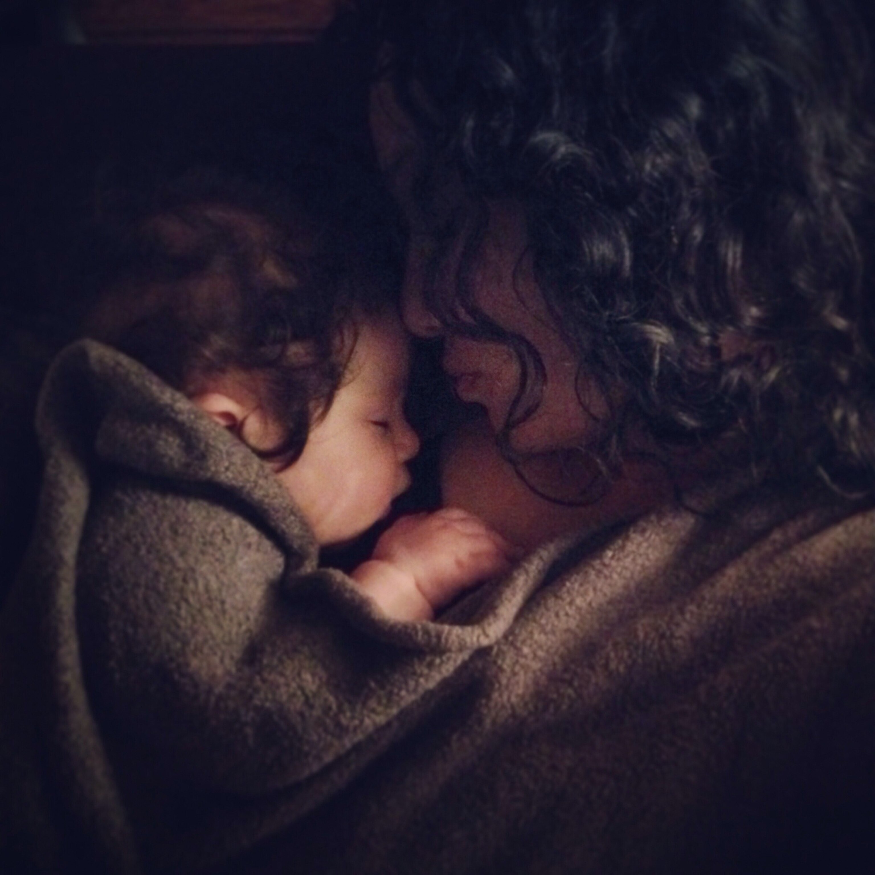 a mother holding her daughter