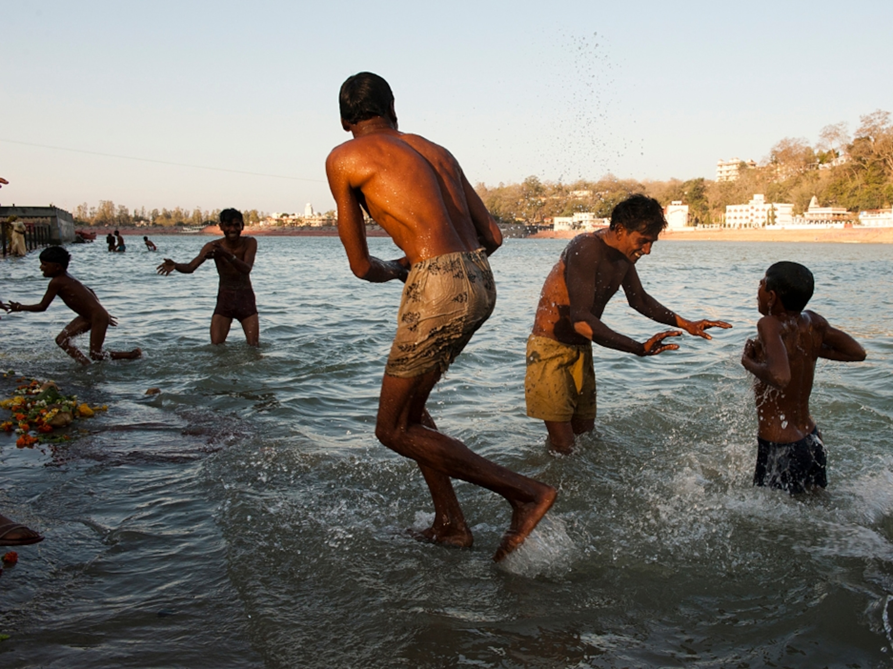 Bathing and playing in Ganges River