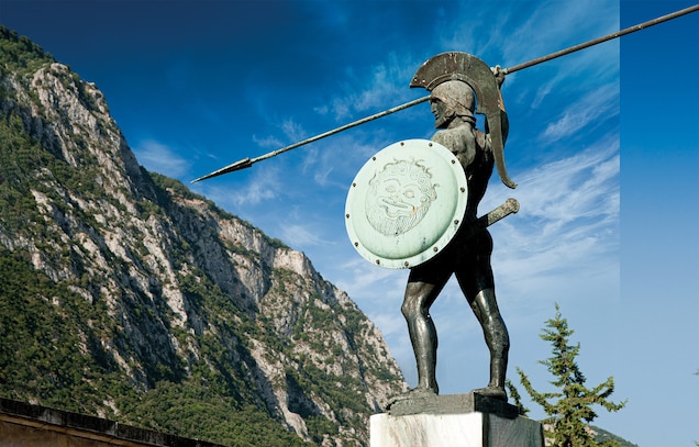 When this memorial to Leonidas was erected at Thermopylae in 1955, the landscape had changed greatly since the battle in 480 B.C. when the Kallidromo massif formed the southern wall of the narrow Thermopylae Pass, and the northern boundary was the Aegean Sea. Over the centuries, silt brought downstream by rivers has shifted the coastline farther north.