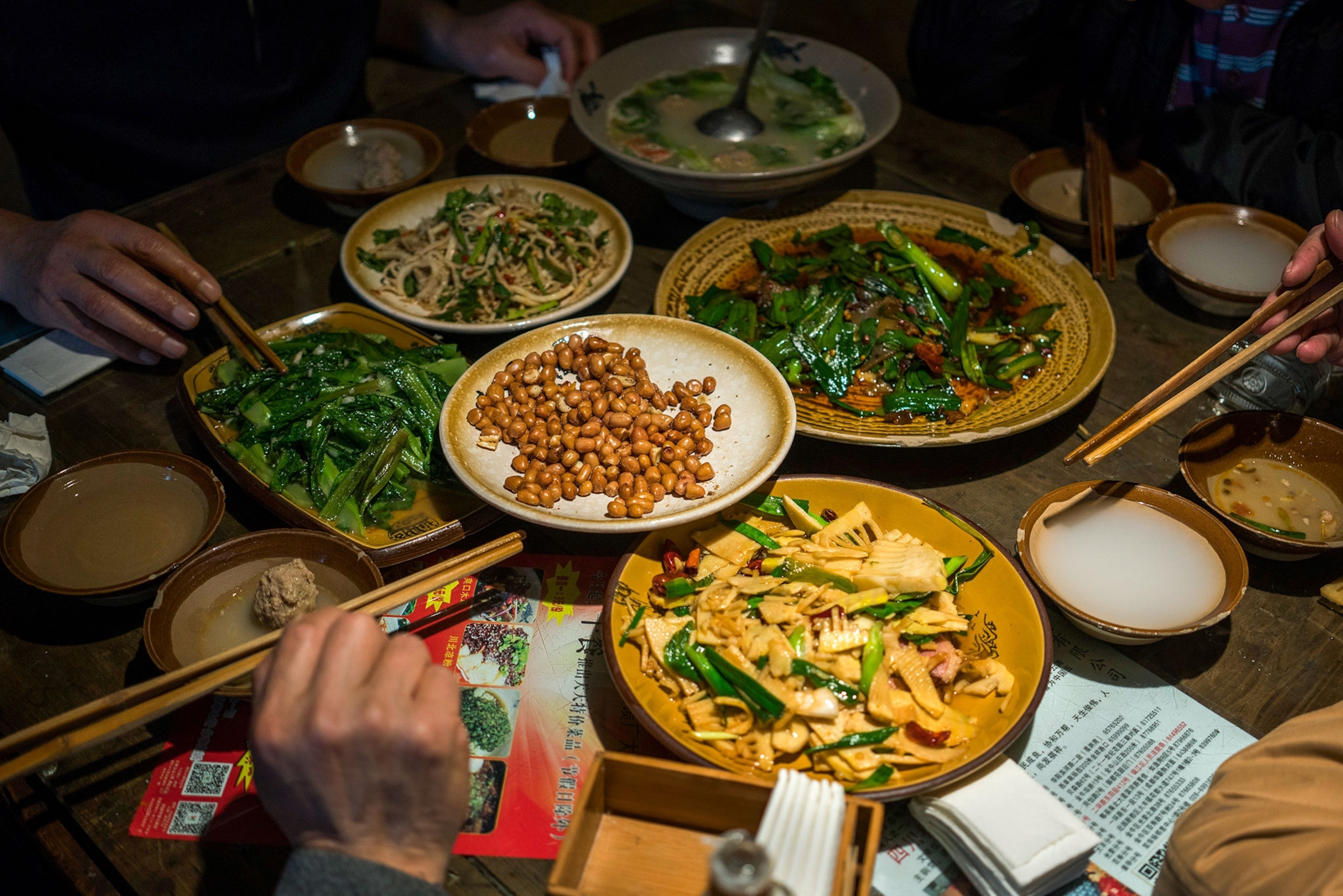 people eating Chinese food in a Chinese restaurant