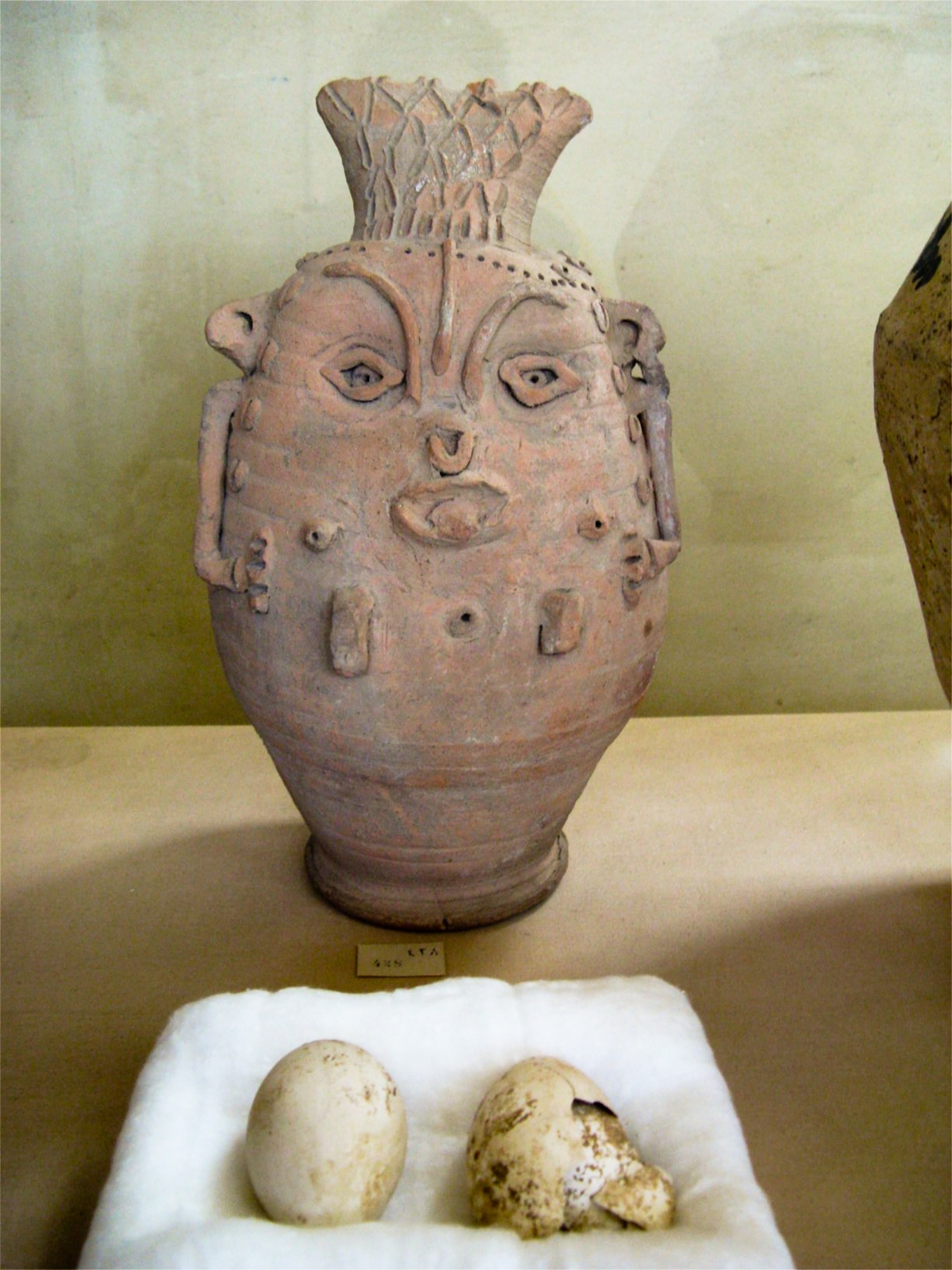 Mallawi Museum - Picture of a ceramic vessel from Tuna el-Gebel bearing the grotesque features of the god Bes