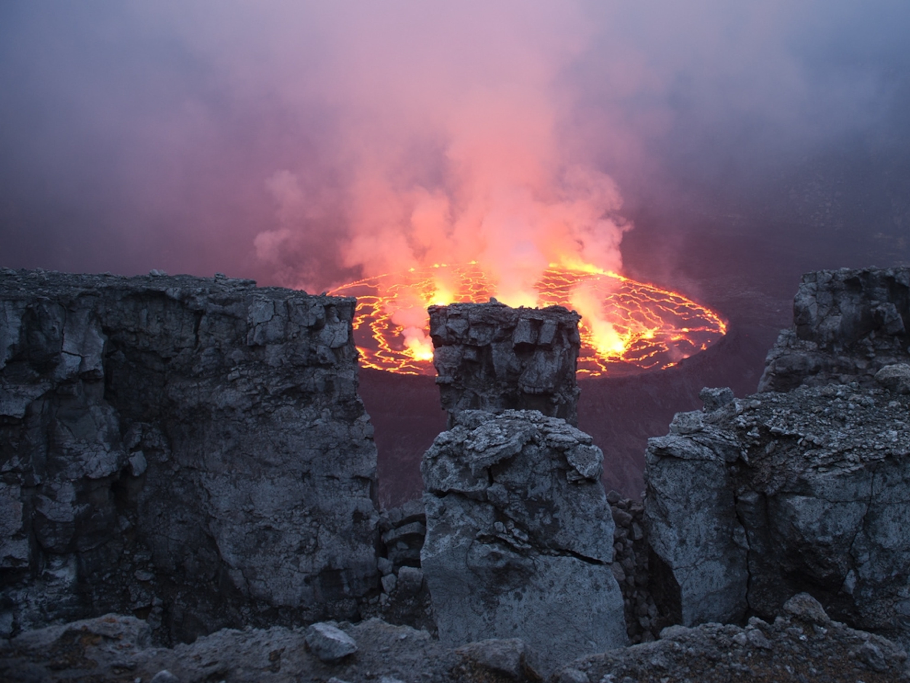 Volcano picture: A lava lake a Nyiragongo Volcano in the Democratic Republic of the Congo, for a gallery on volcano tourism