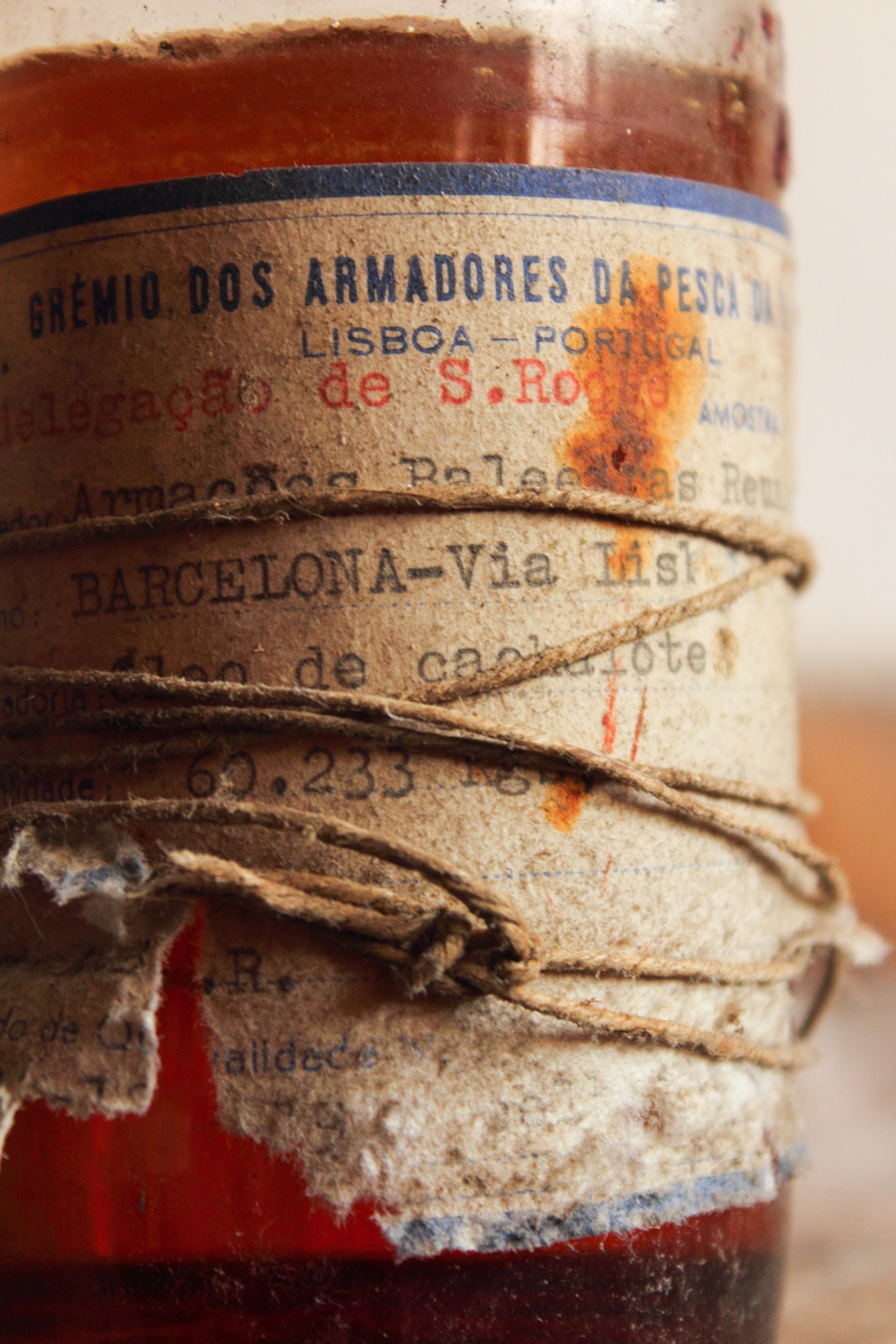 an old bottle of sperm whale oil left in a whaling factory on the island of Faial