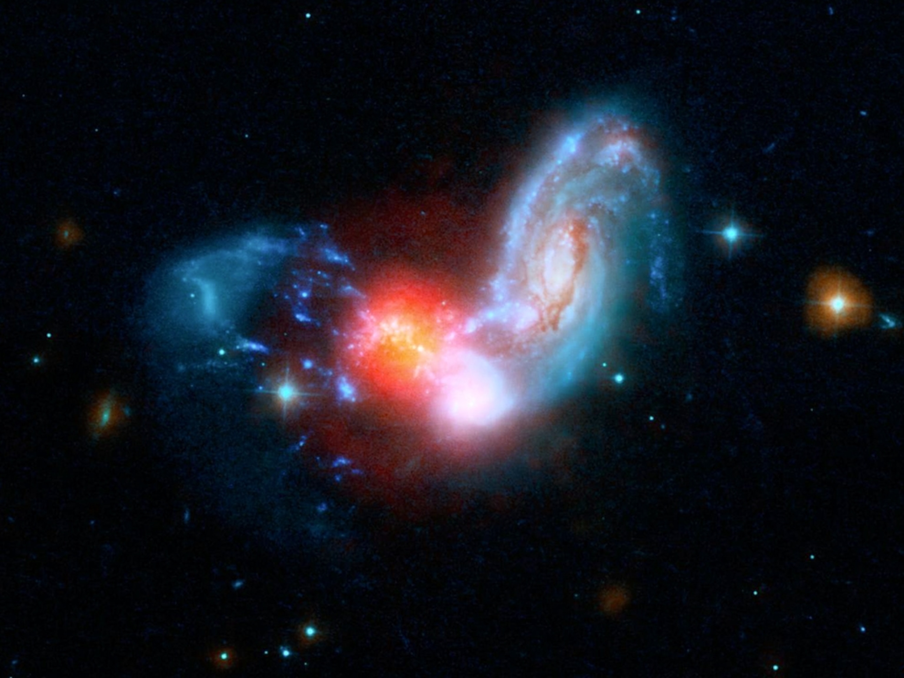 Star birth triggered by two galaxies colliding picture.