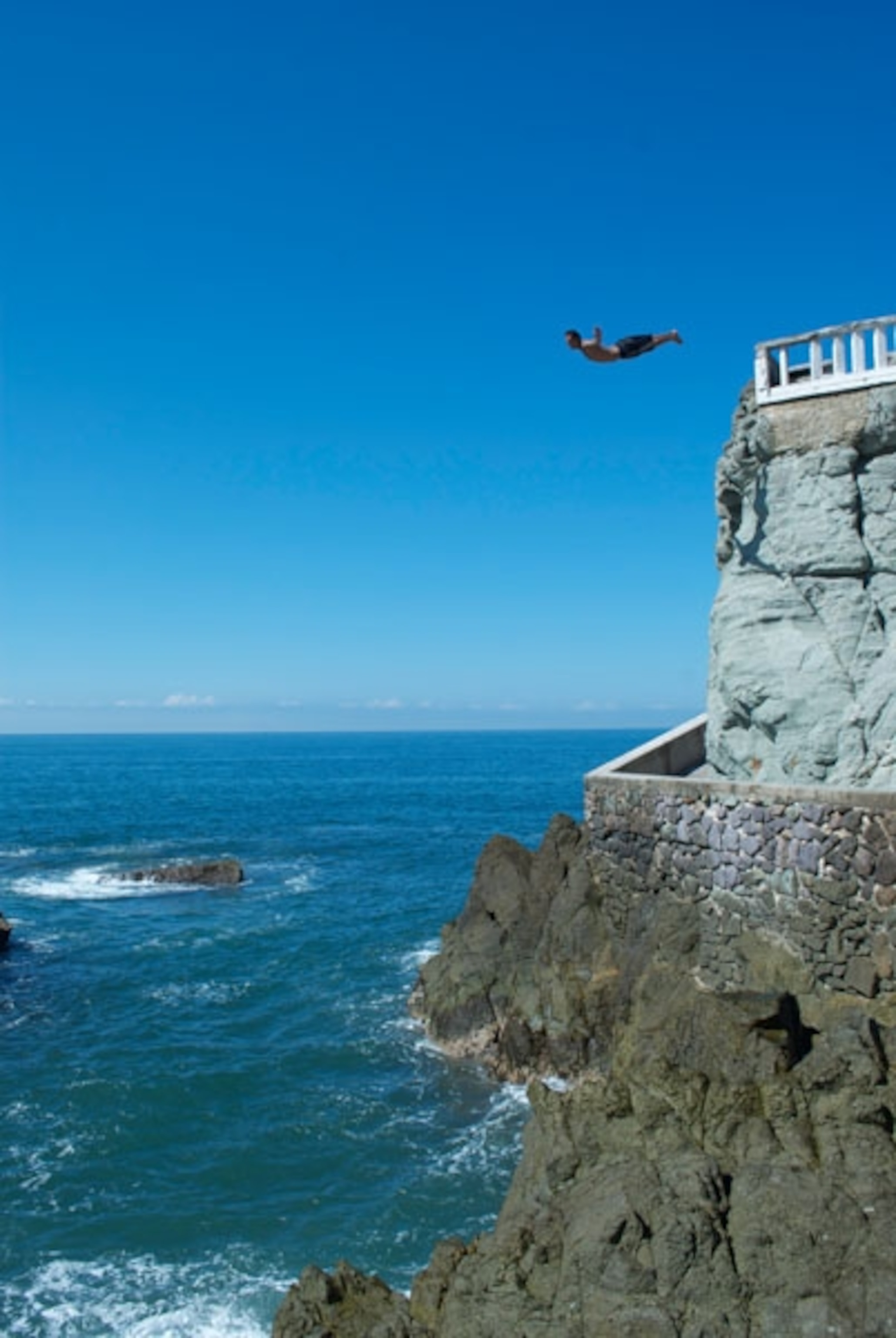 A man diving into the sea in Mazatlan, Mexico