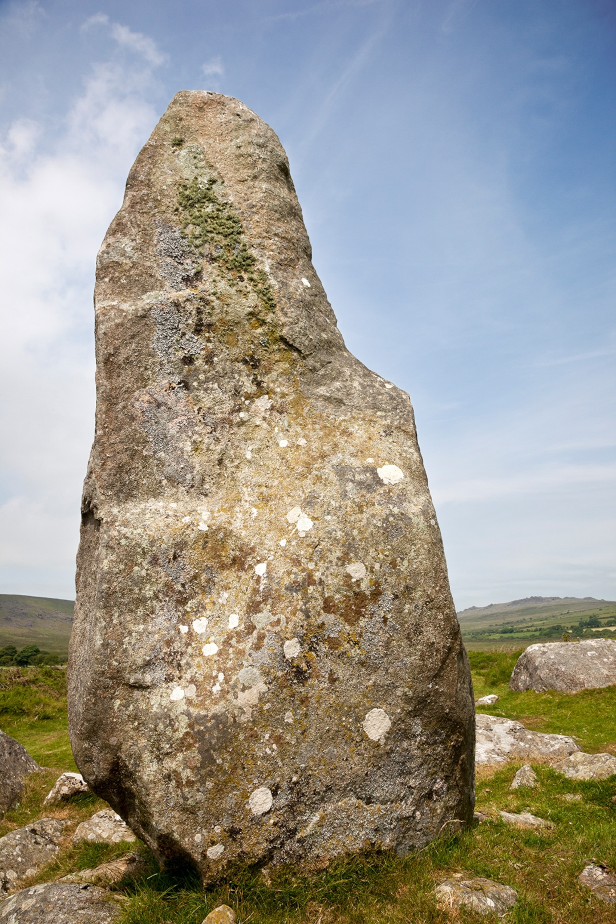 A very large grey standing rock