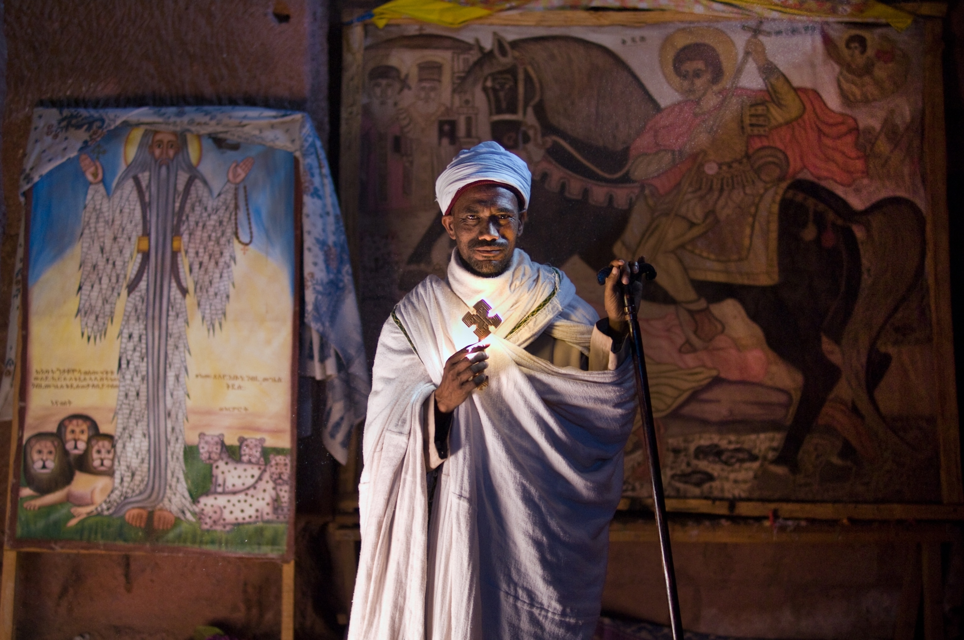 an Orthodox priest in a rock-cut church in Ethiopia