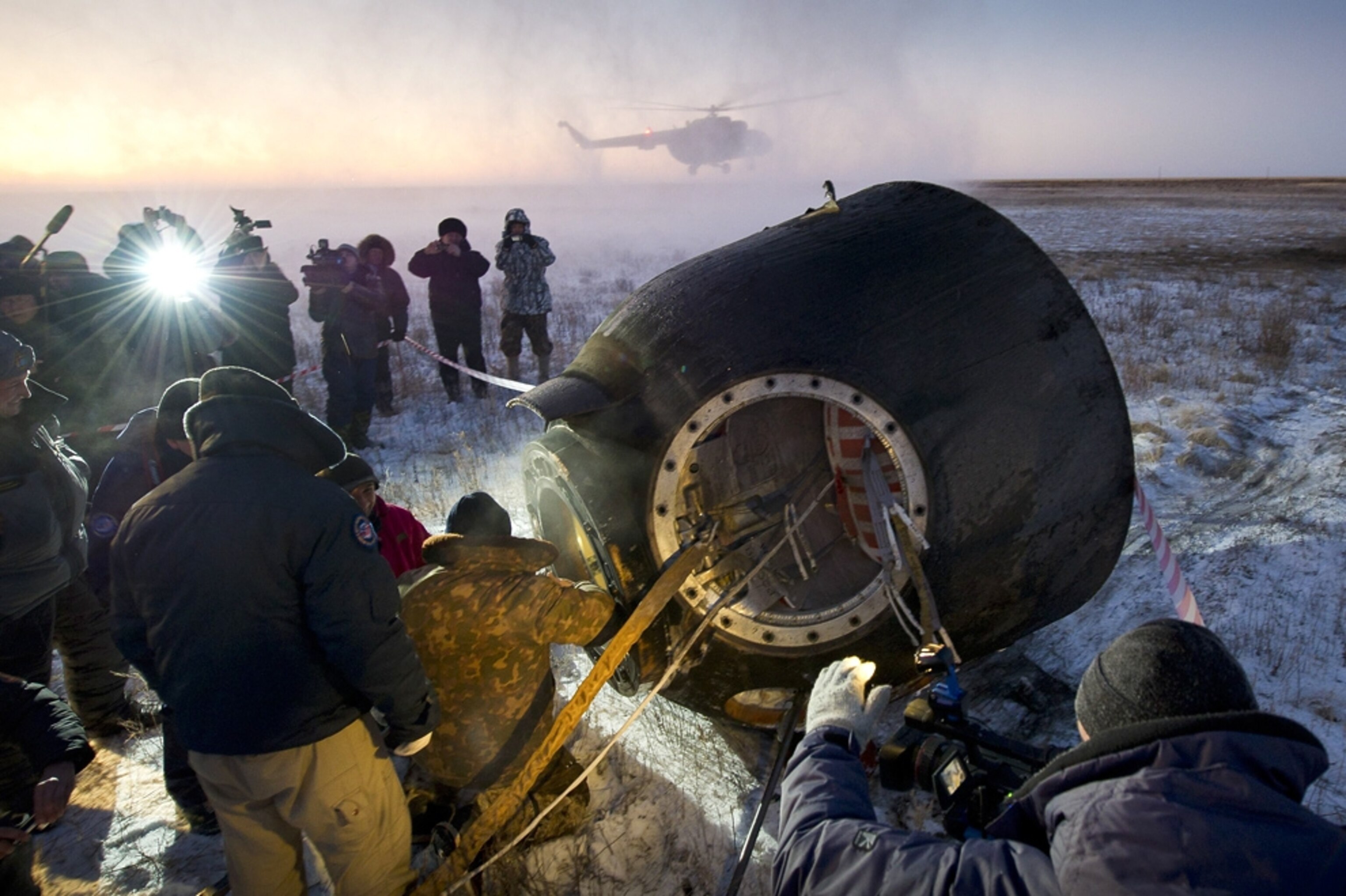 Astronaut picture: workers help astronauts out of a capsule - for gallery of the best space pictures of the week