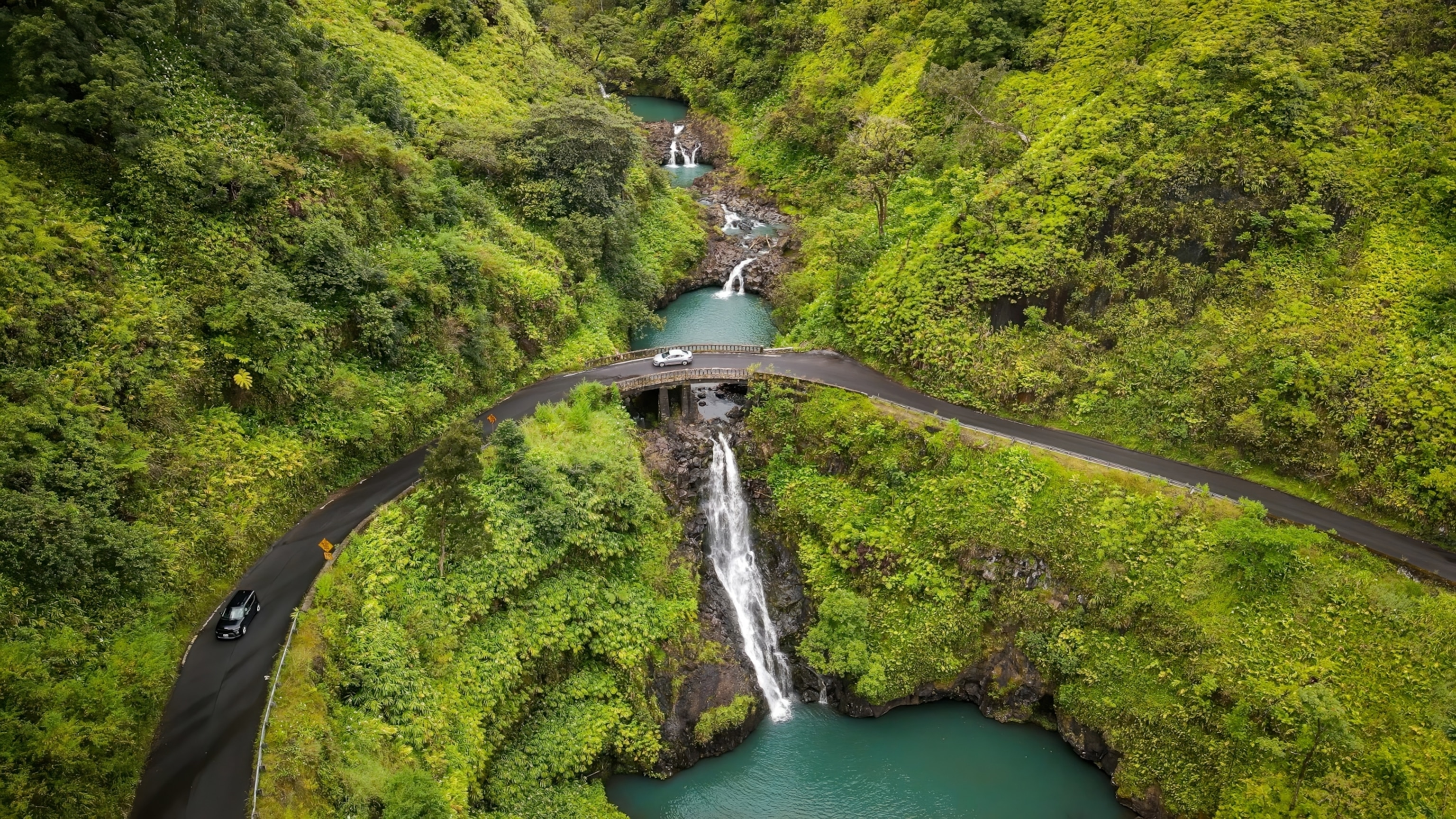 A view from top to the Maui waterfalls and one of the famous bridges which is the Road to Hana