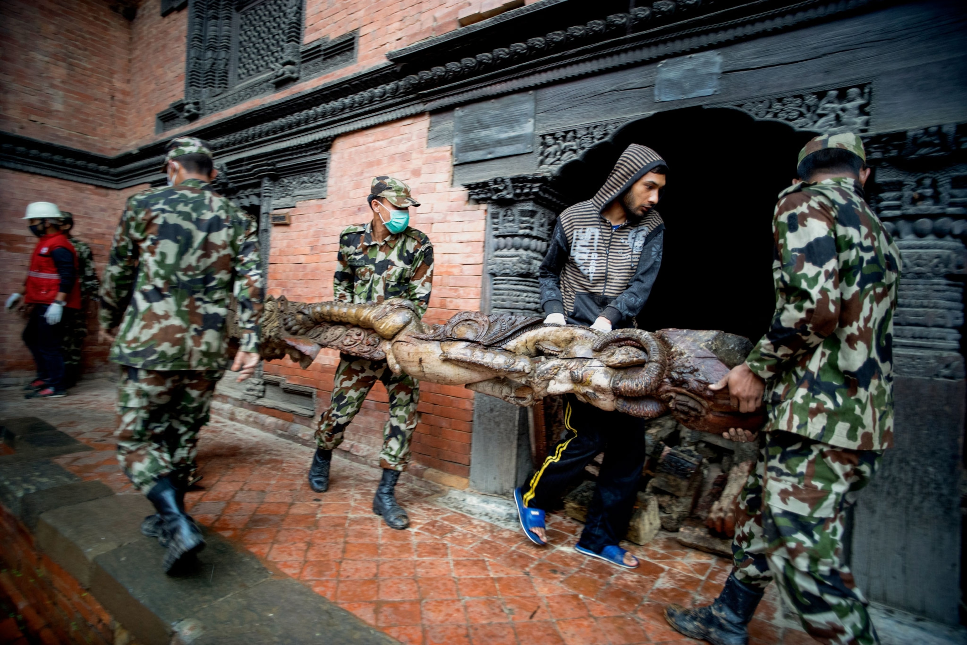 Nepalese security forces excavating ancient carvings and artifacts in Nepal