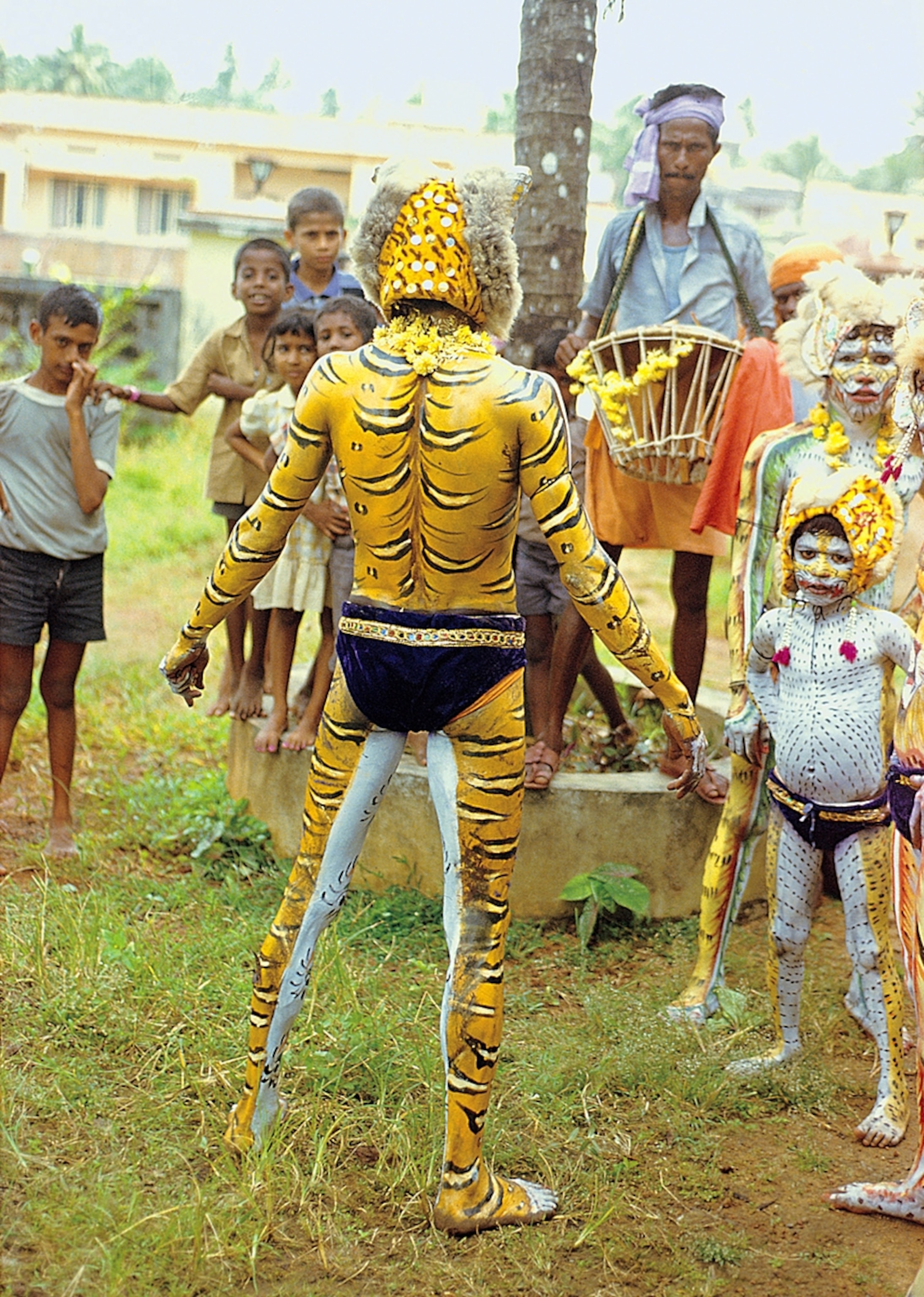 man dressed for a traditional tiger dance in India