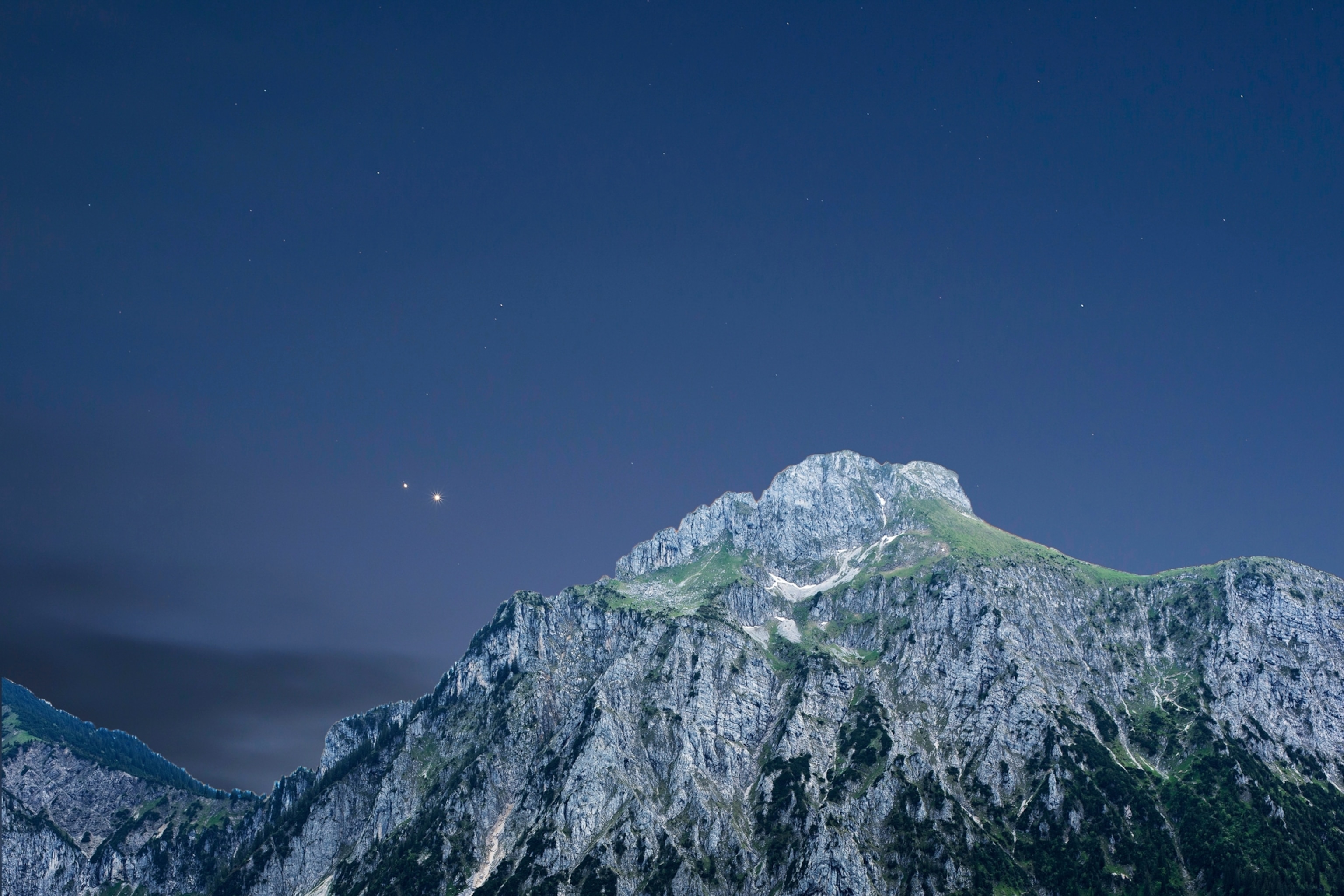 Jupiter and Venus conjunction above the alpine mountains.