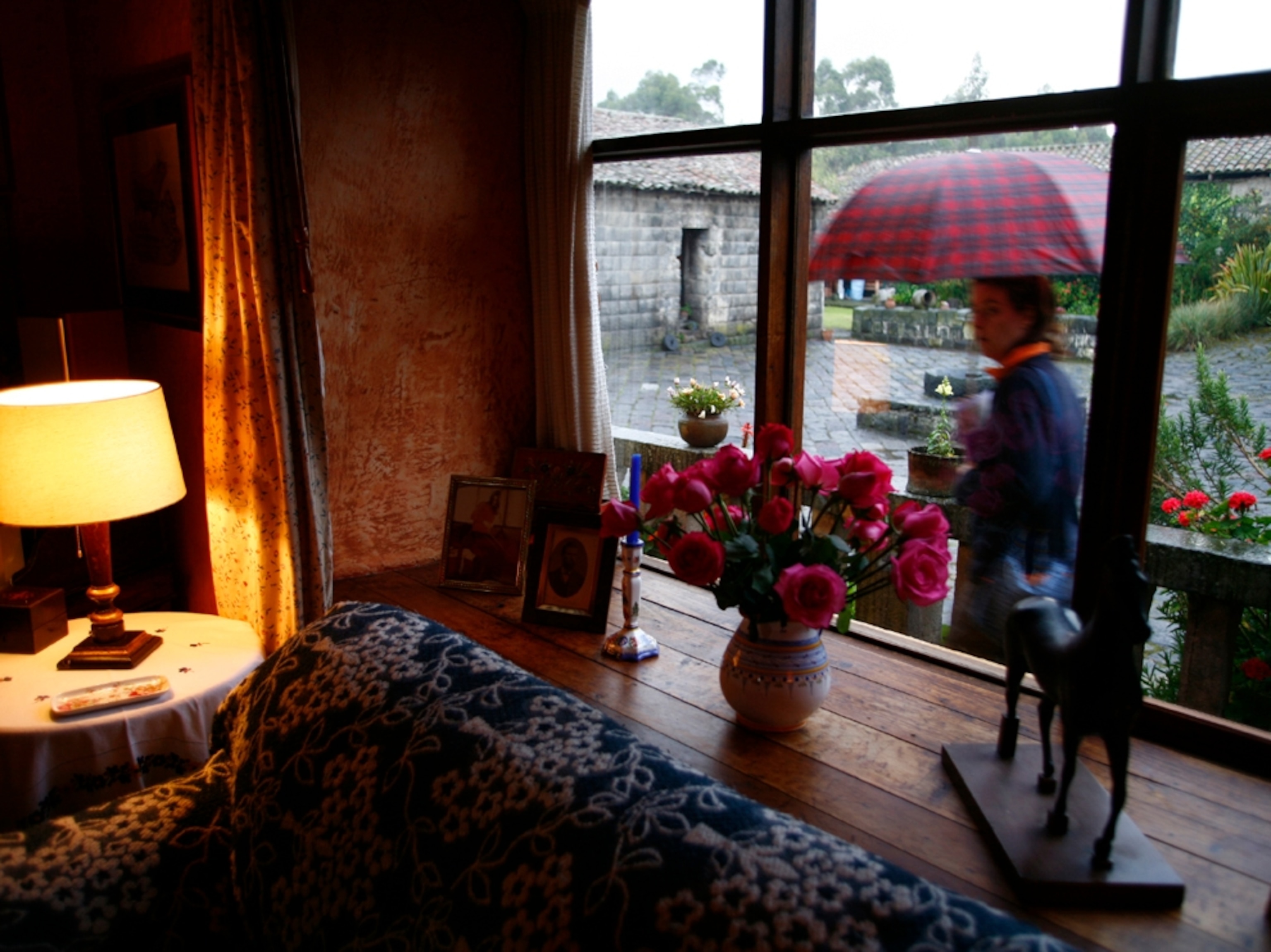 Girl with umbrella, Hacienda San Agustin de Callo, Ecuador