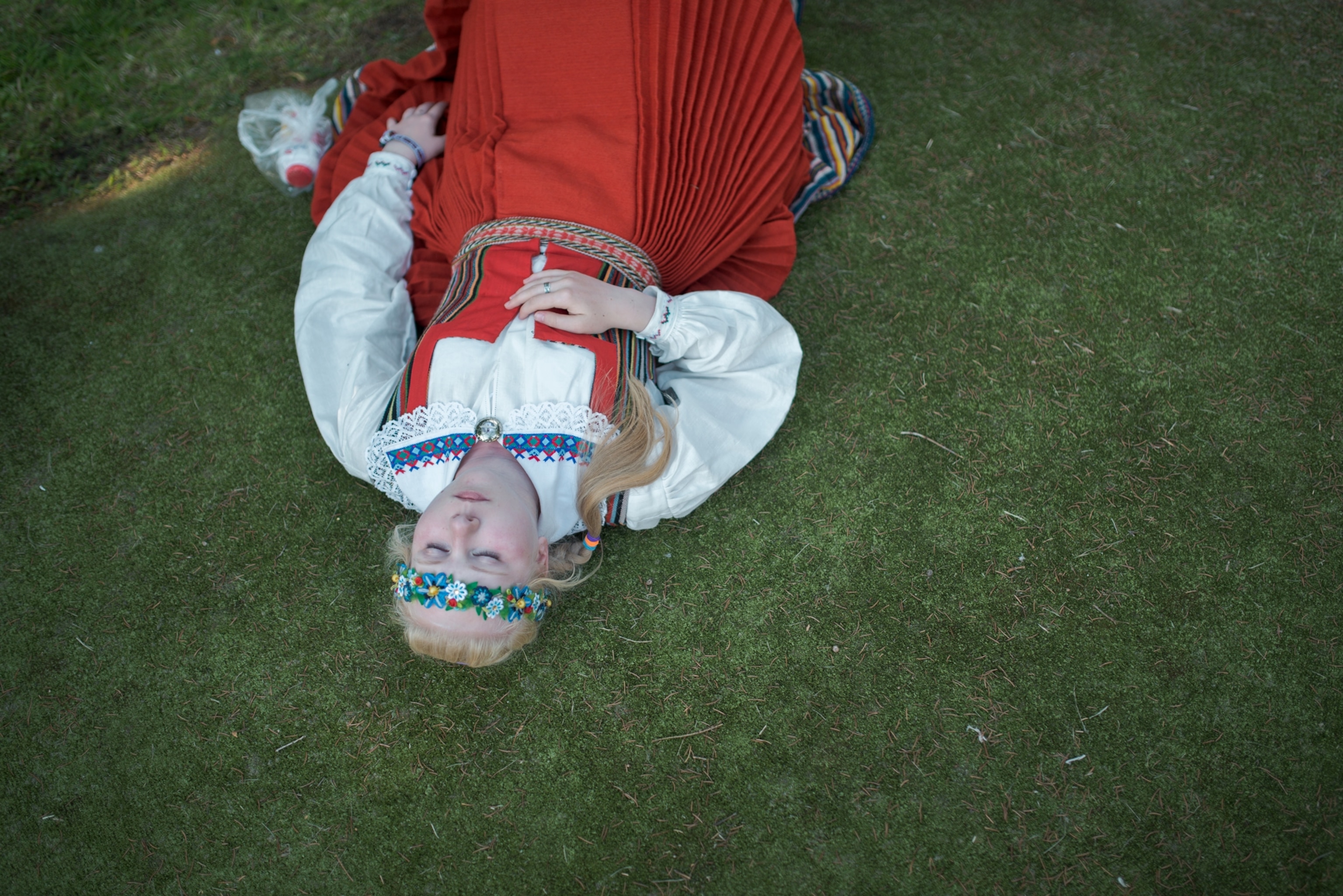 a women resting on the grass