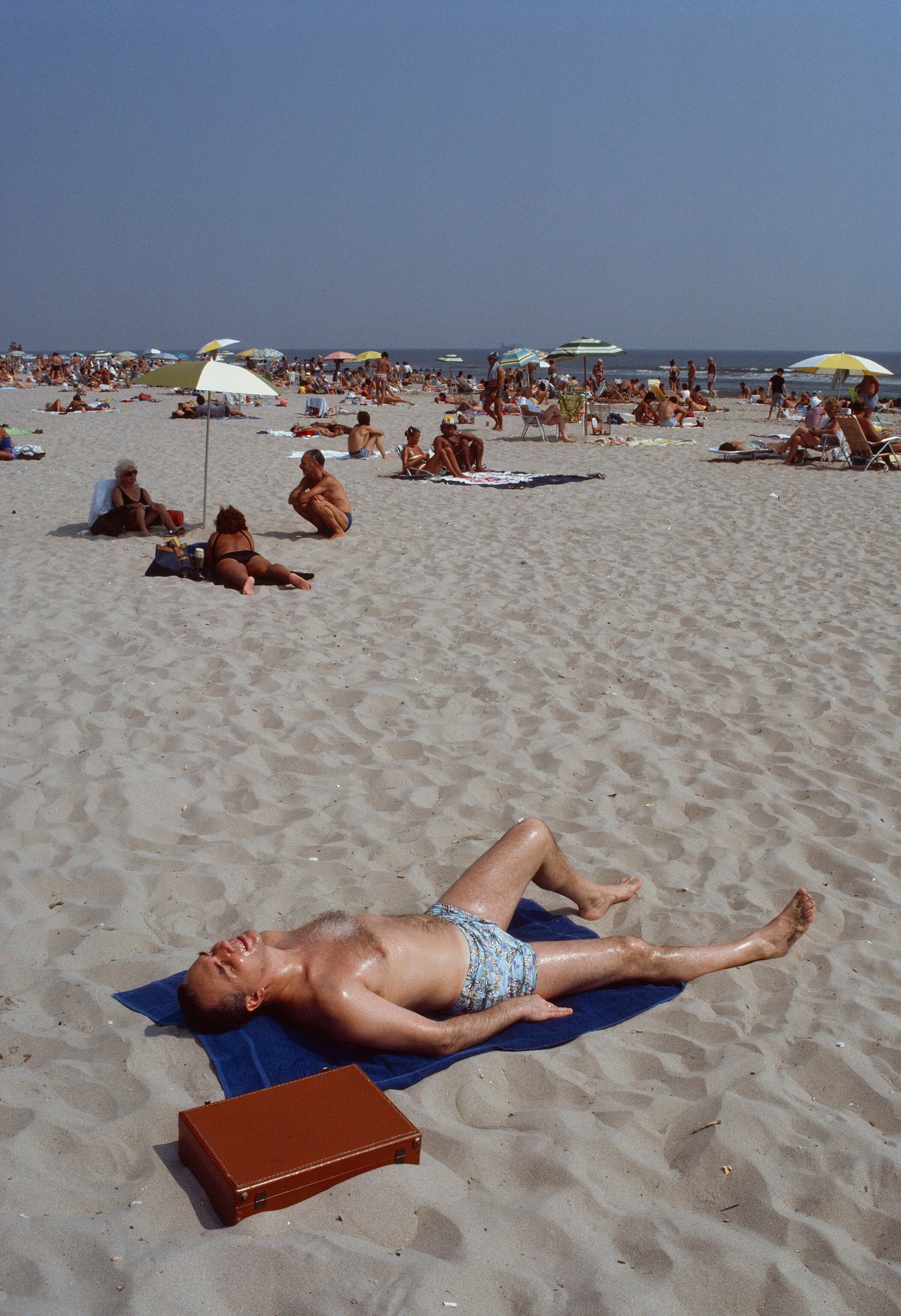 man laying on beach