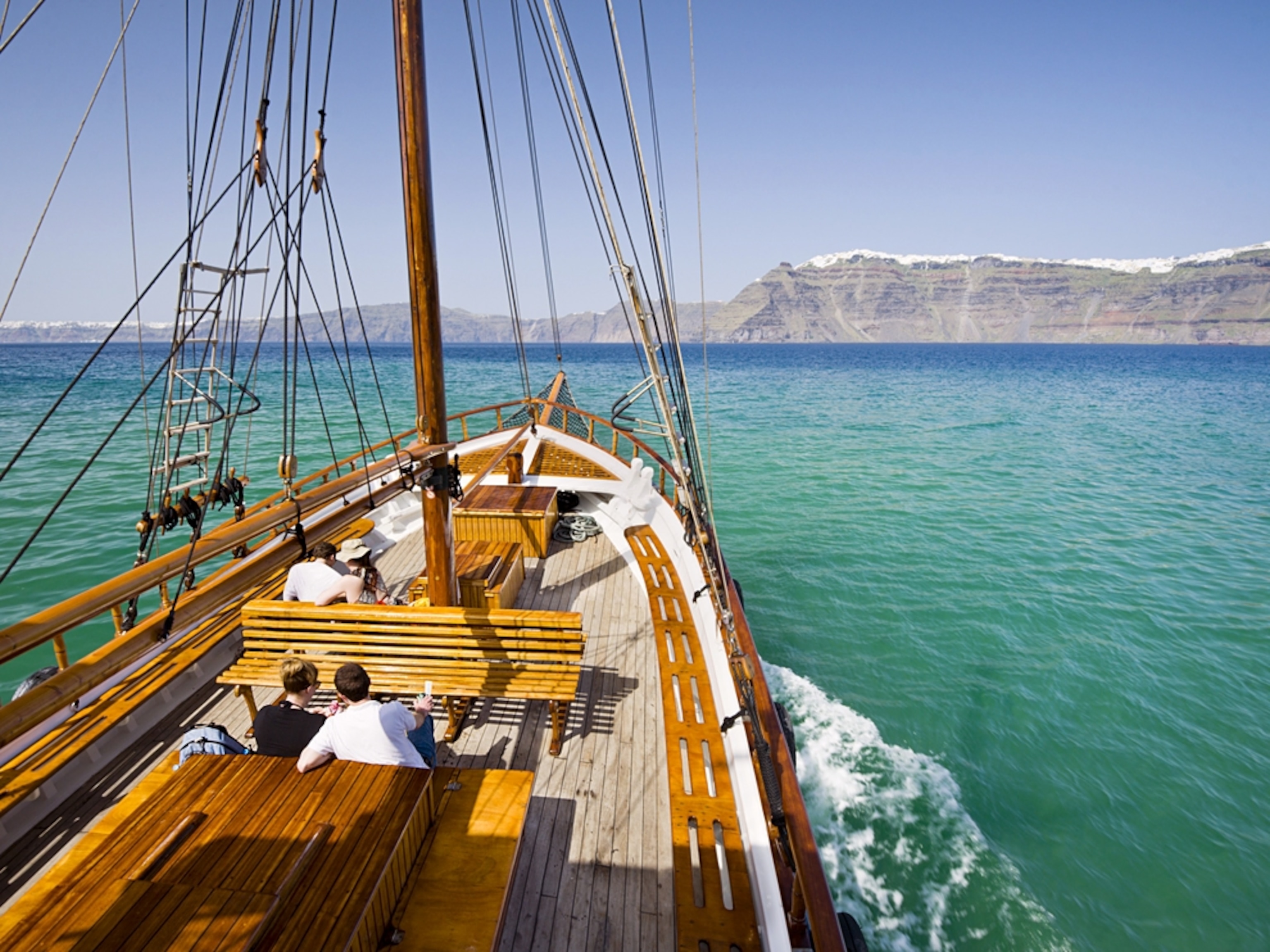 sailboat entering Thira Old Port, Greece