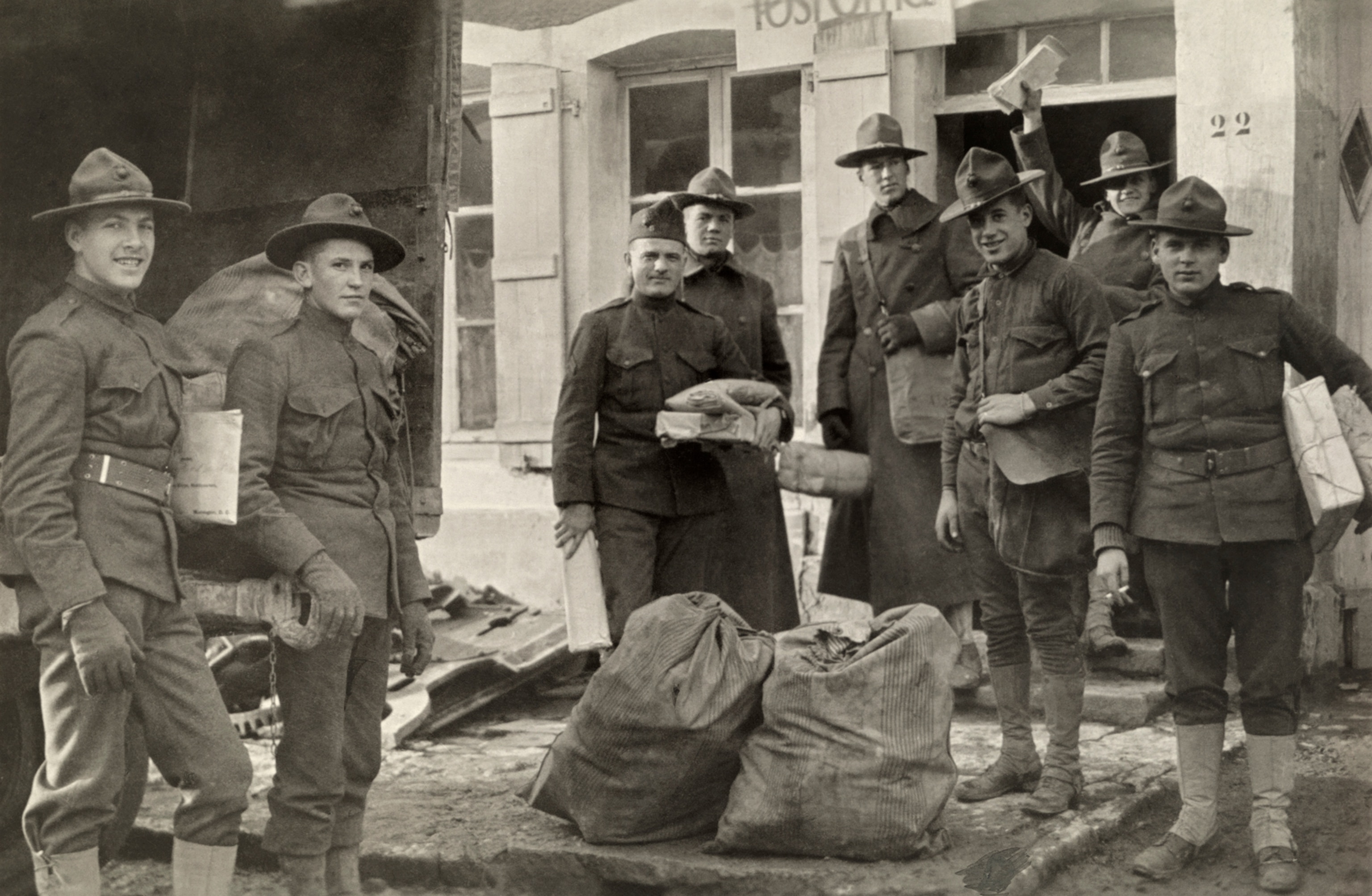 U.S. soldiers in France receive Christmas packages during WWI.