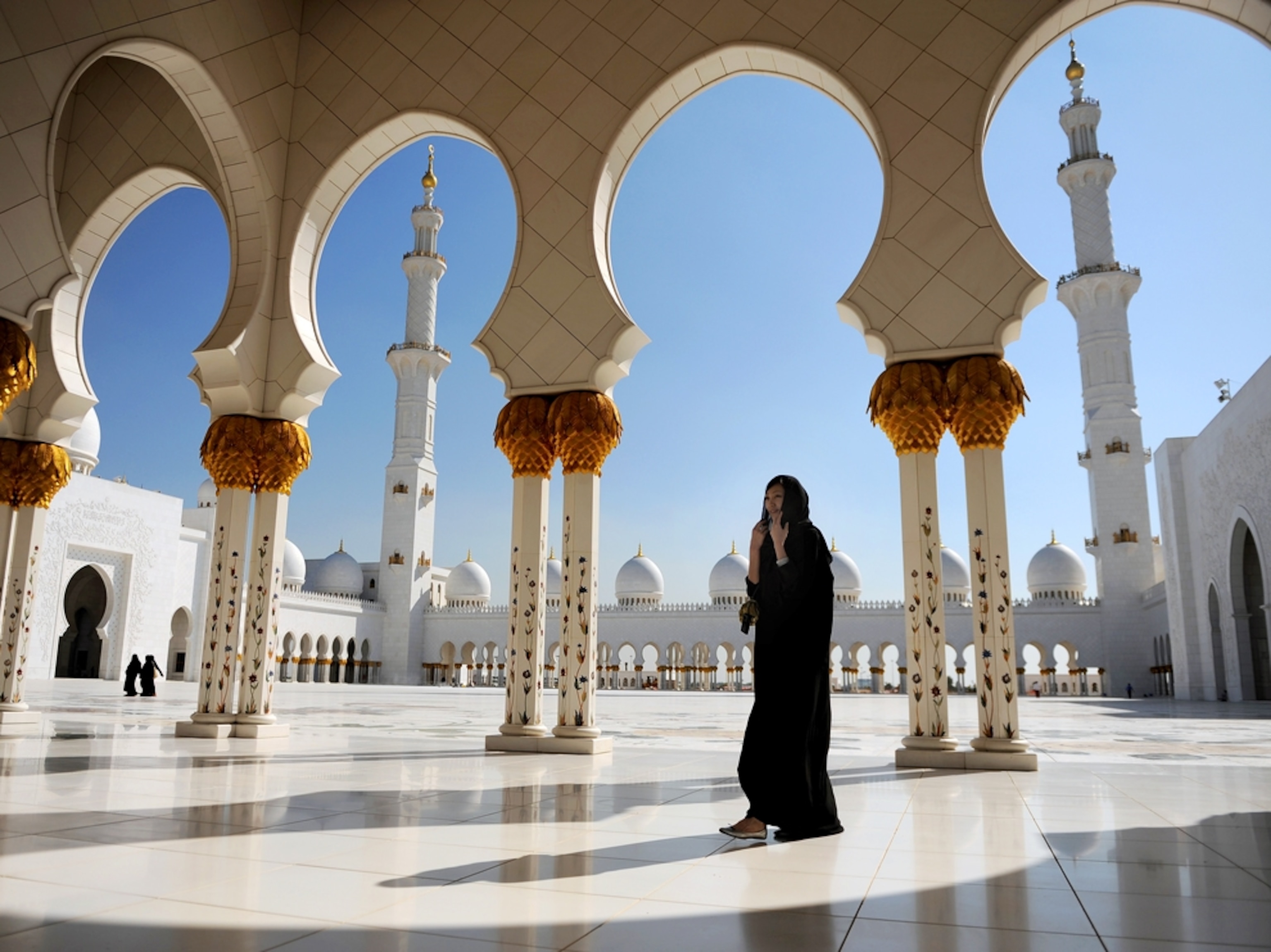 Woman walks through mosque
