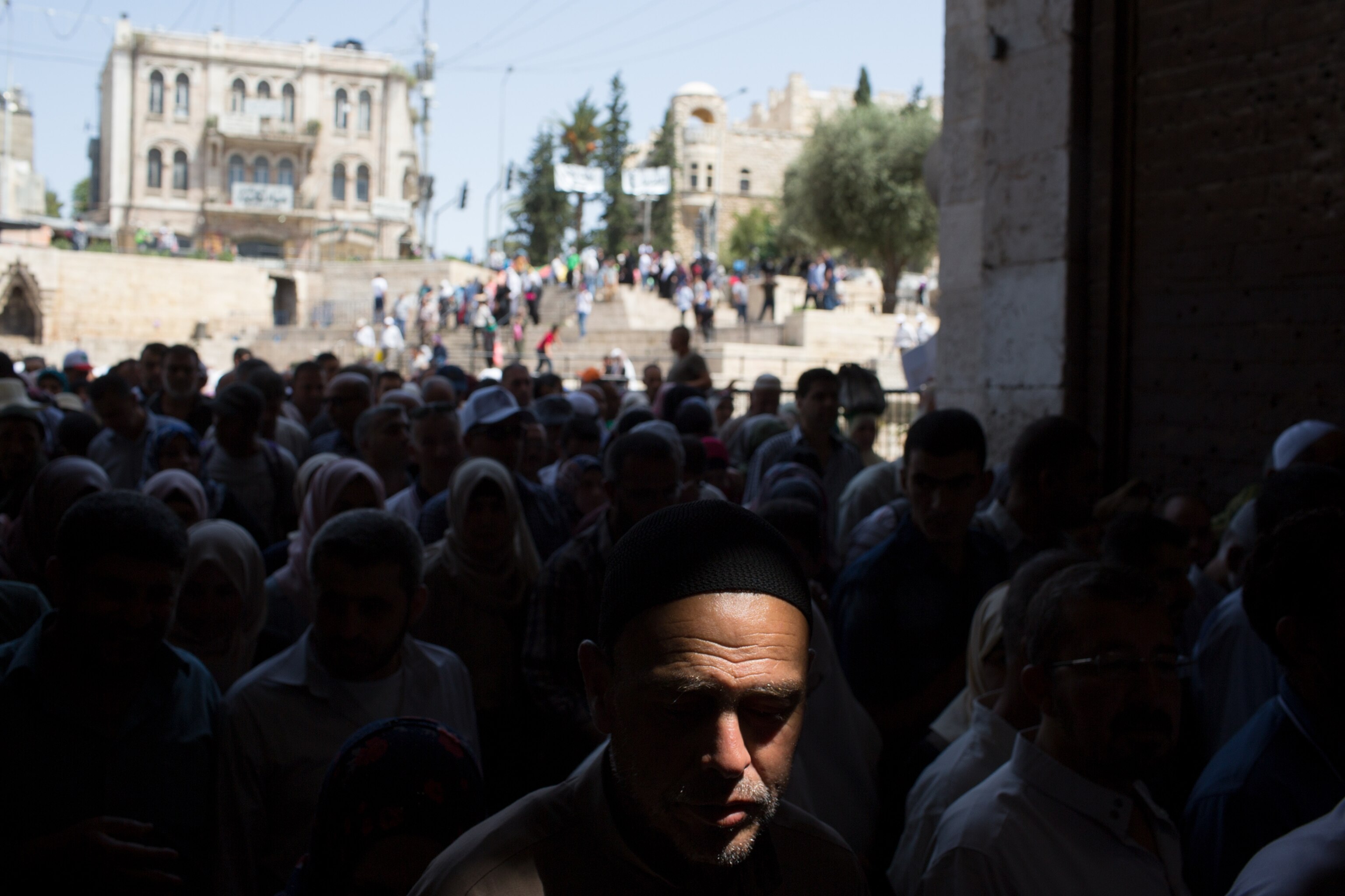 crowds entering the old city of Jerusalem through Damascus gate in Jerusalem, Israel