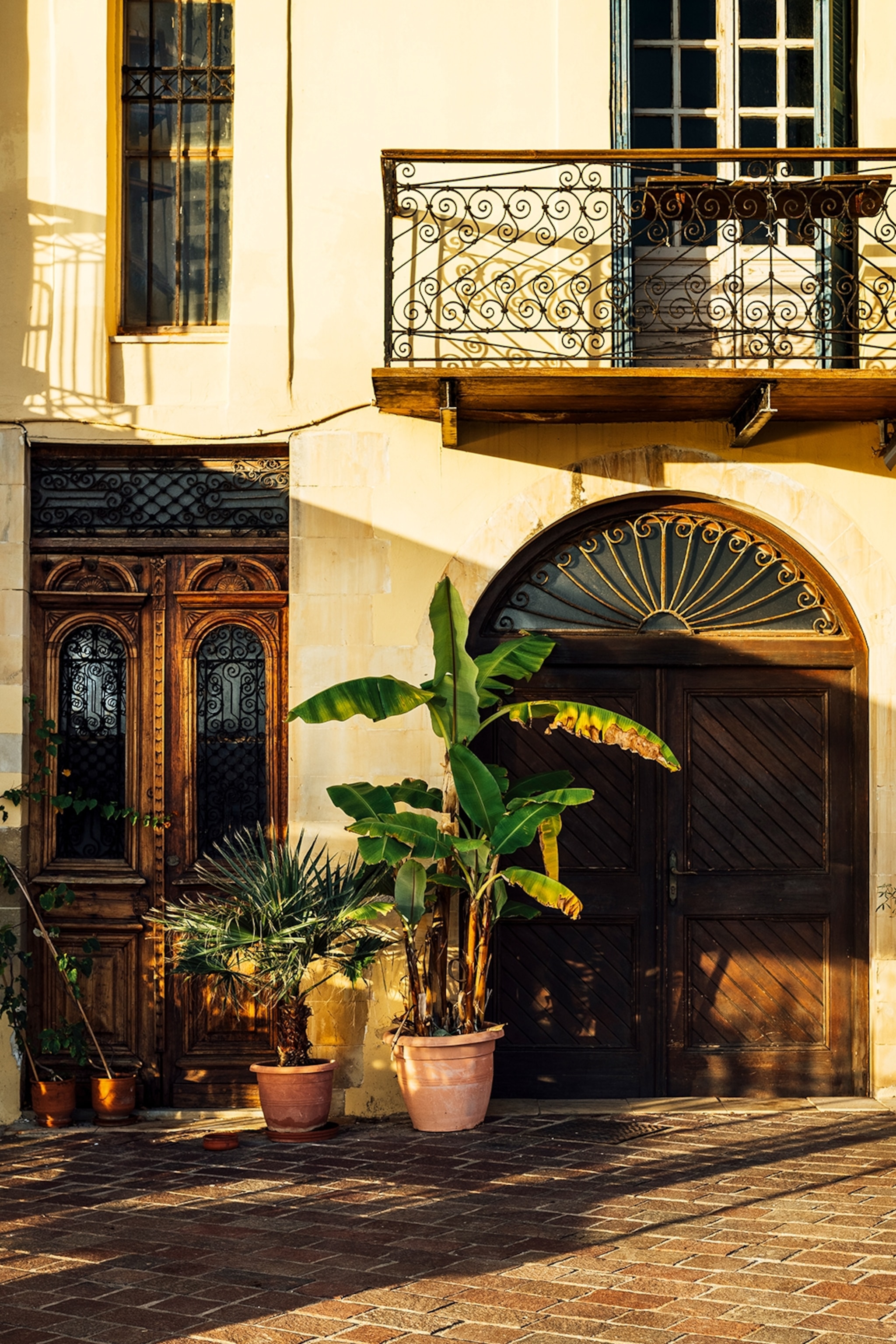 Street view of a Venetian building on a sunny day.