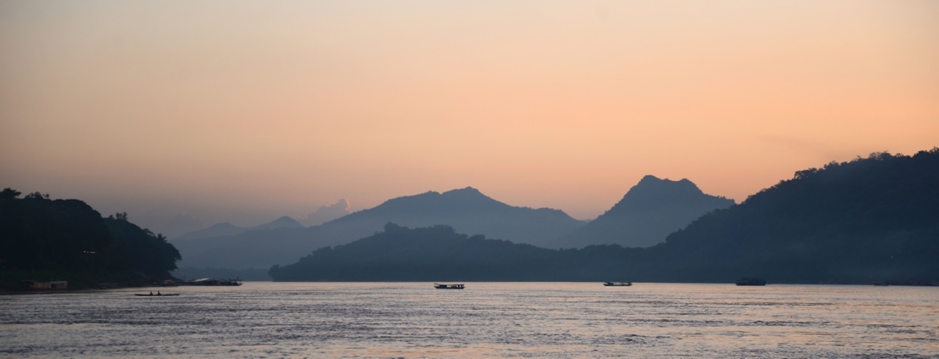 Sunset on the Mekong River, driving through Laos (Photo by Andrew Evans, National Geographic)