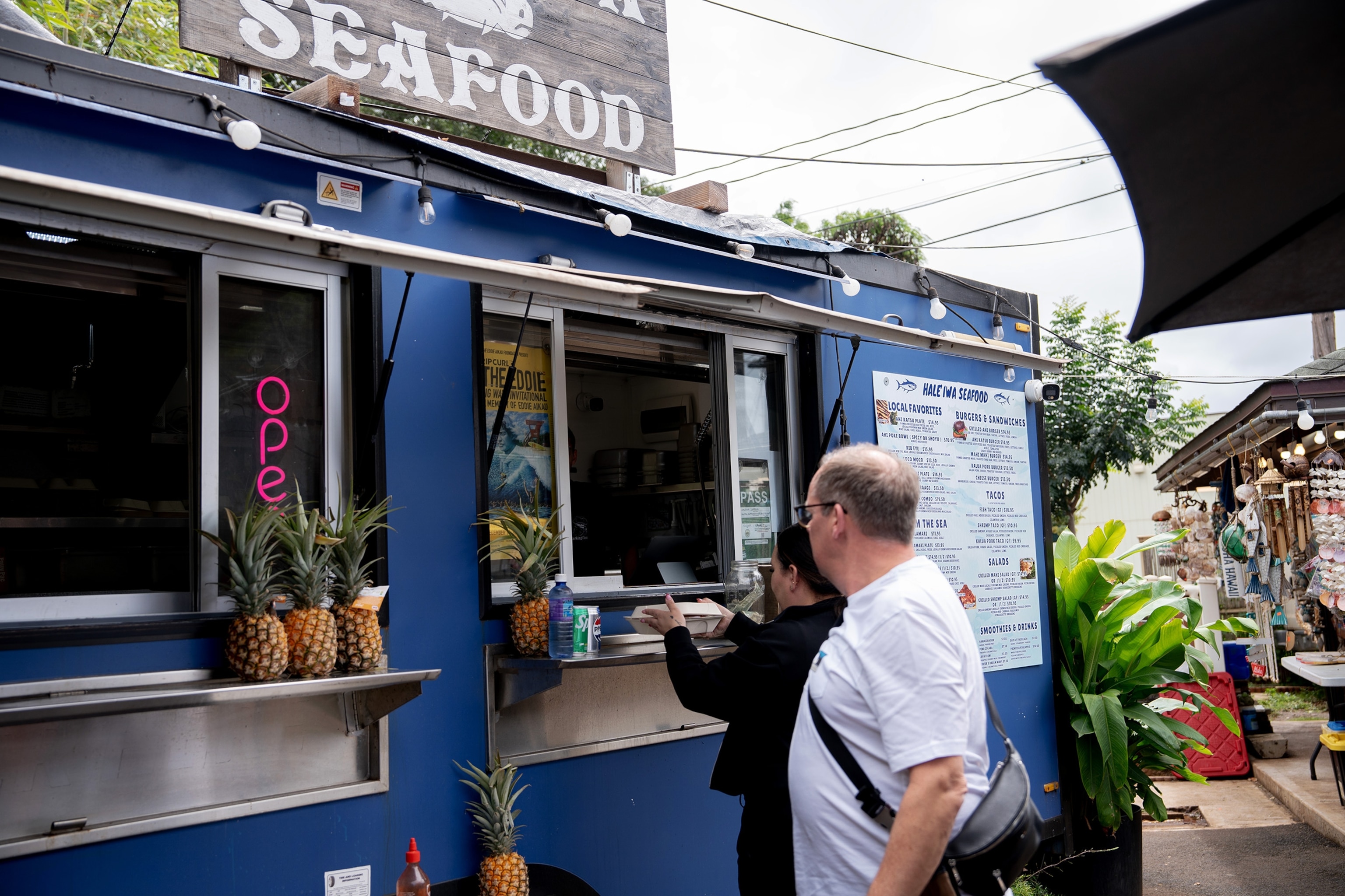 Food truck serving local dish of Loco Moco to Patrons