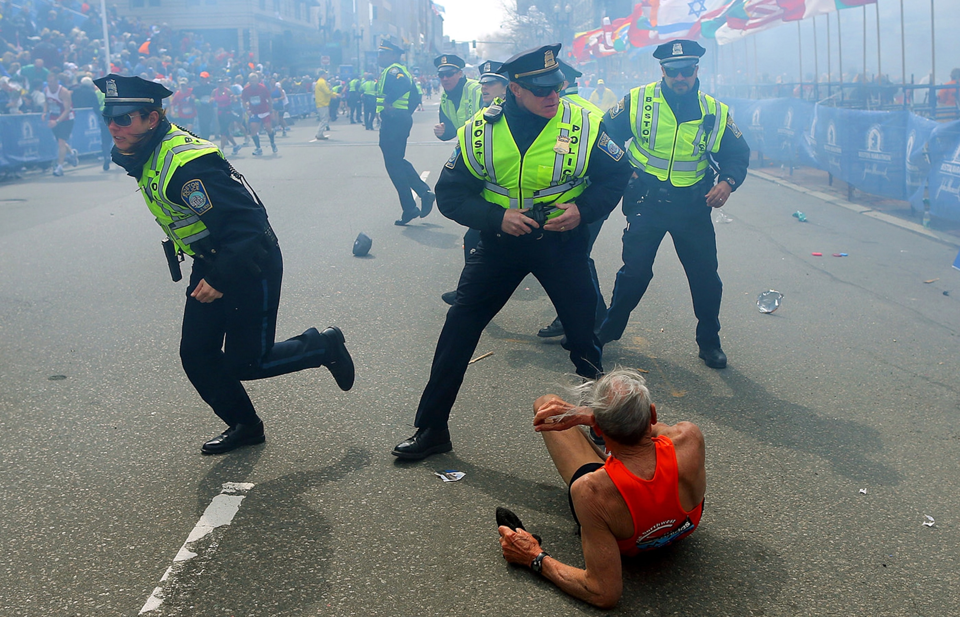 police officers and a Boston Marathon runner after a terror attack in April.