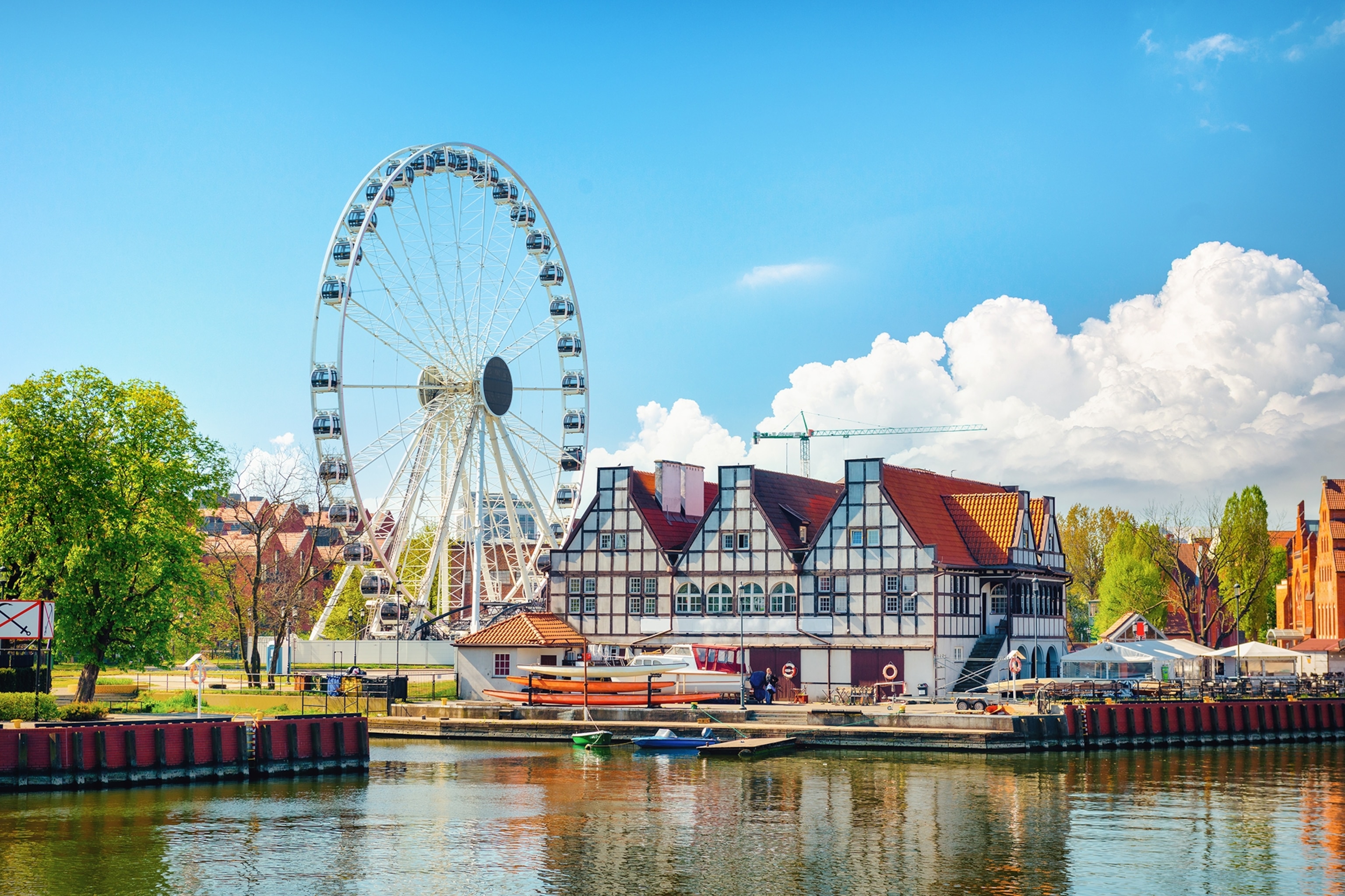 a cityscape with a ferris wheel