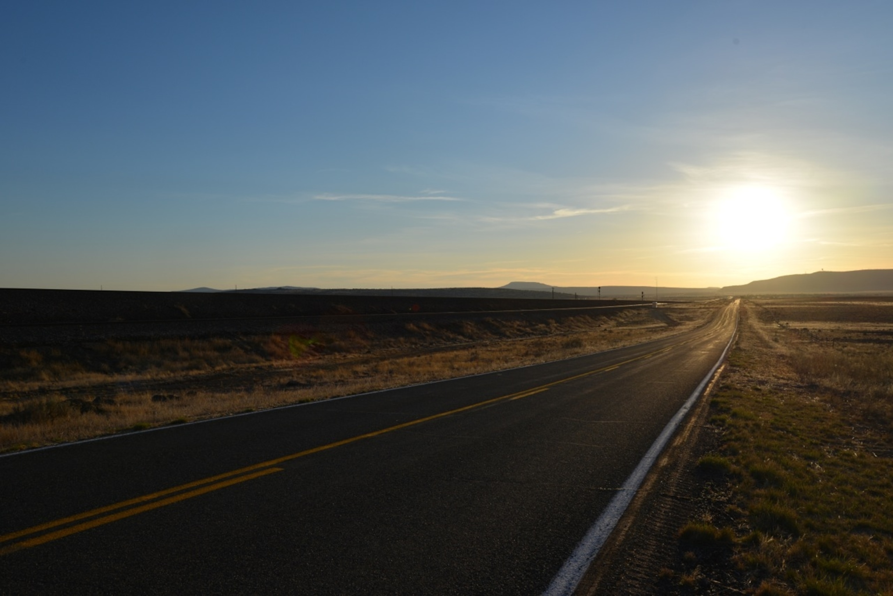 The sun sets on Route 66 in western Arizona. (Photo by Andrew Evans, National Geographic Travel)