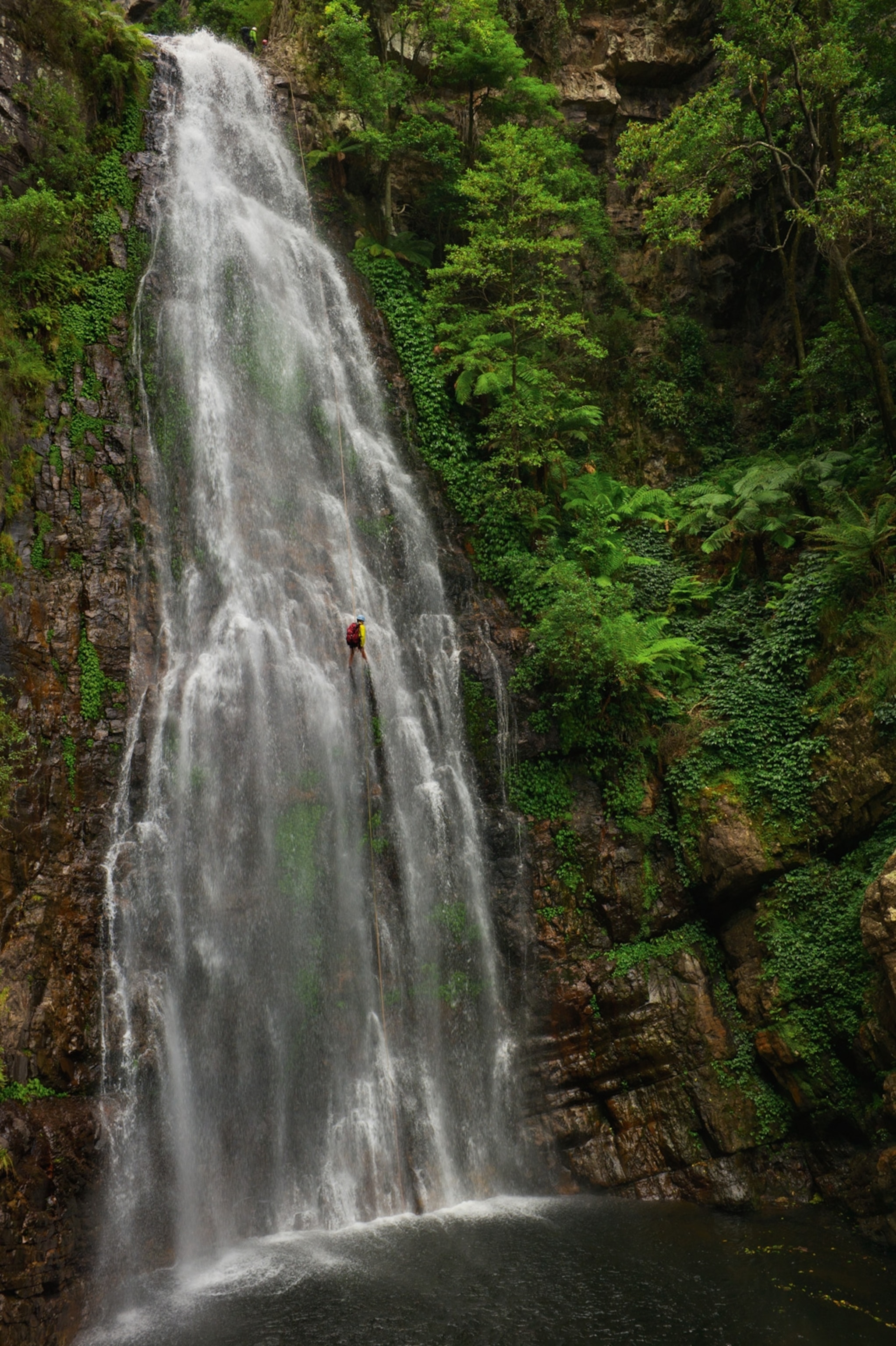a canyoneer descending through one of Kanangra Main Canyon's three 150-foot waterfalls