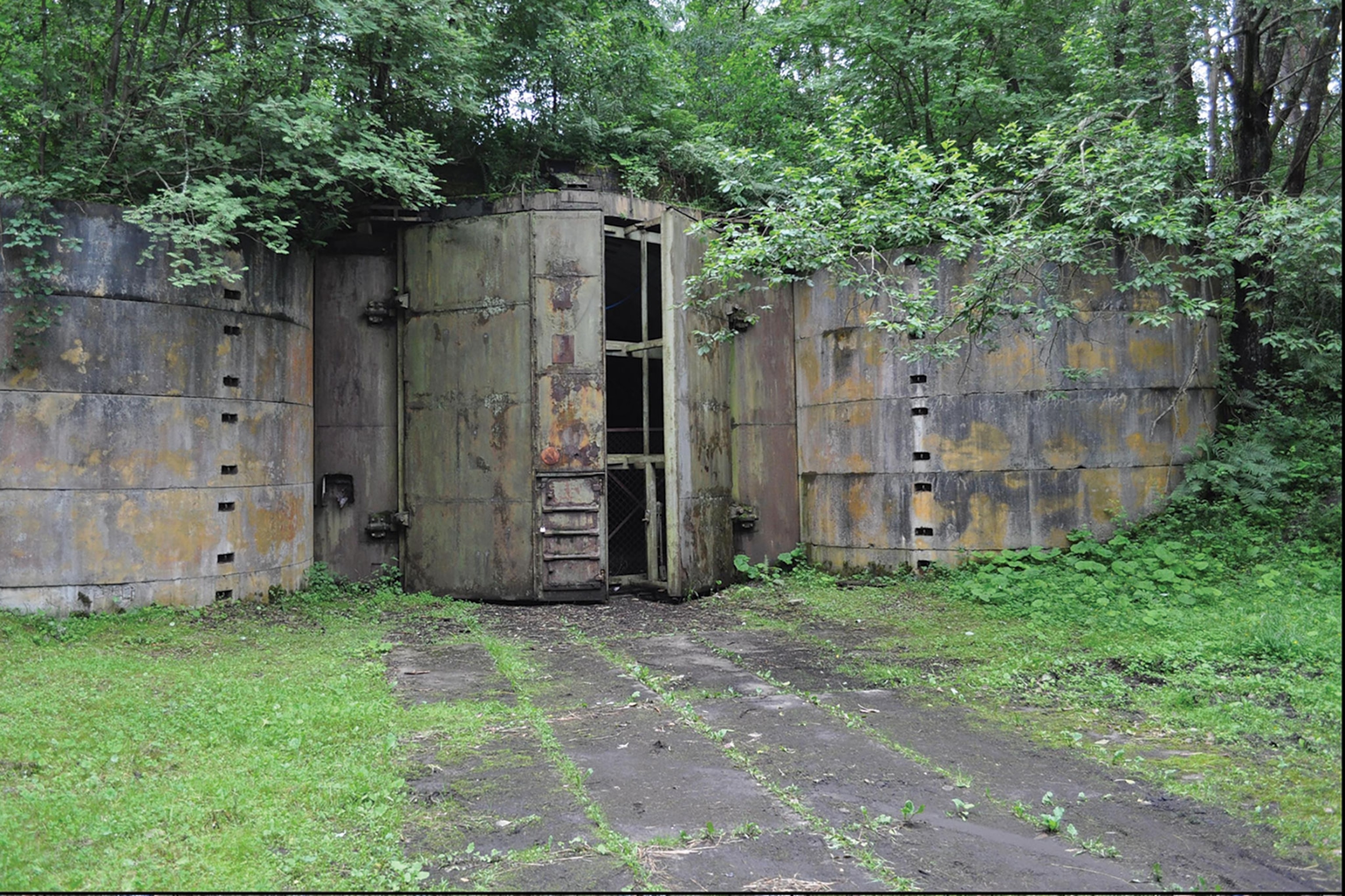 a granite Cold War bunker with graffiti on it