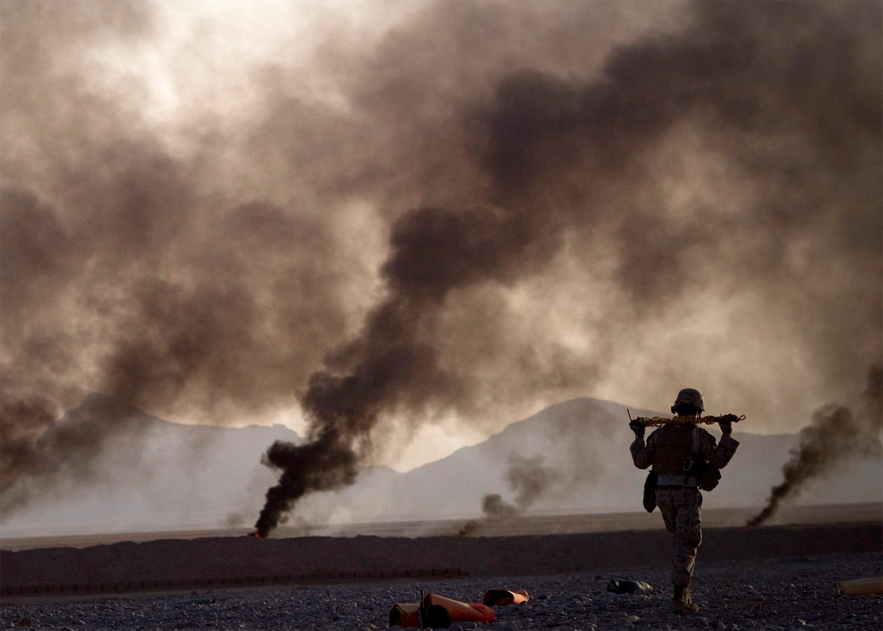 an Afghan National Police officer manning a checkpoint.