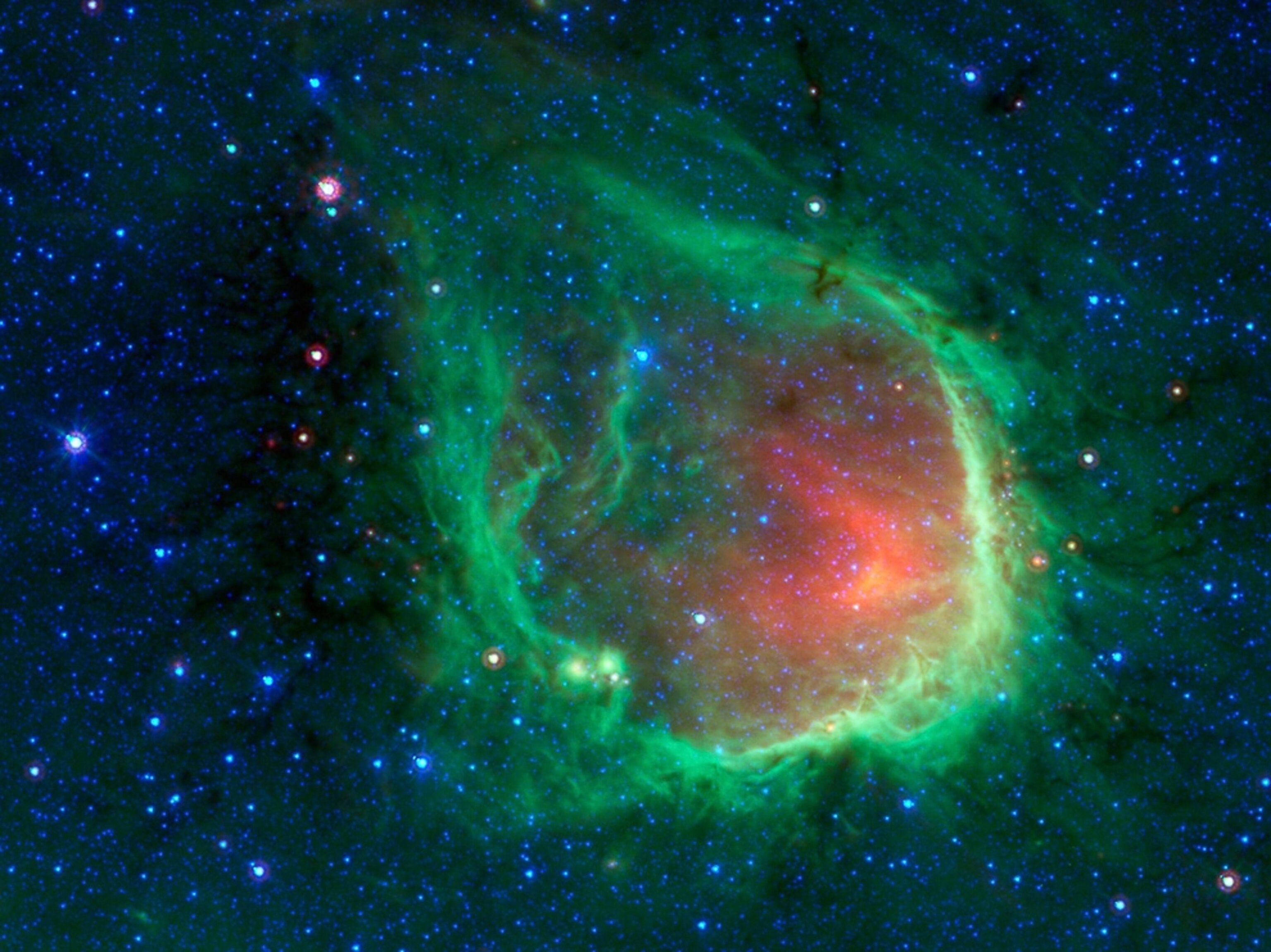 http://www.spitzer.caltech.edu/images/3647-sig11-007-In-the-Blackest-Night-a-Green-Ring-Nebula