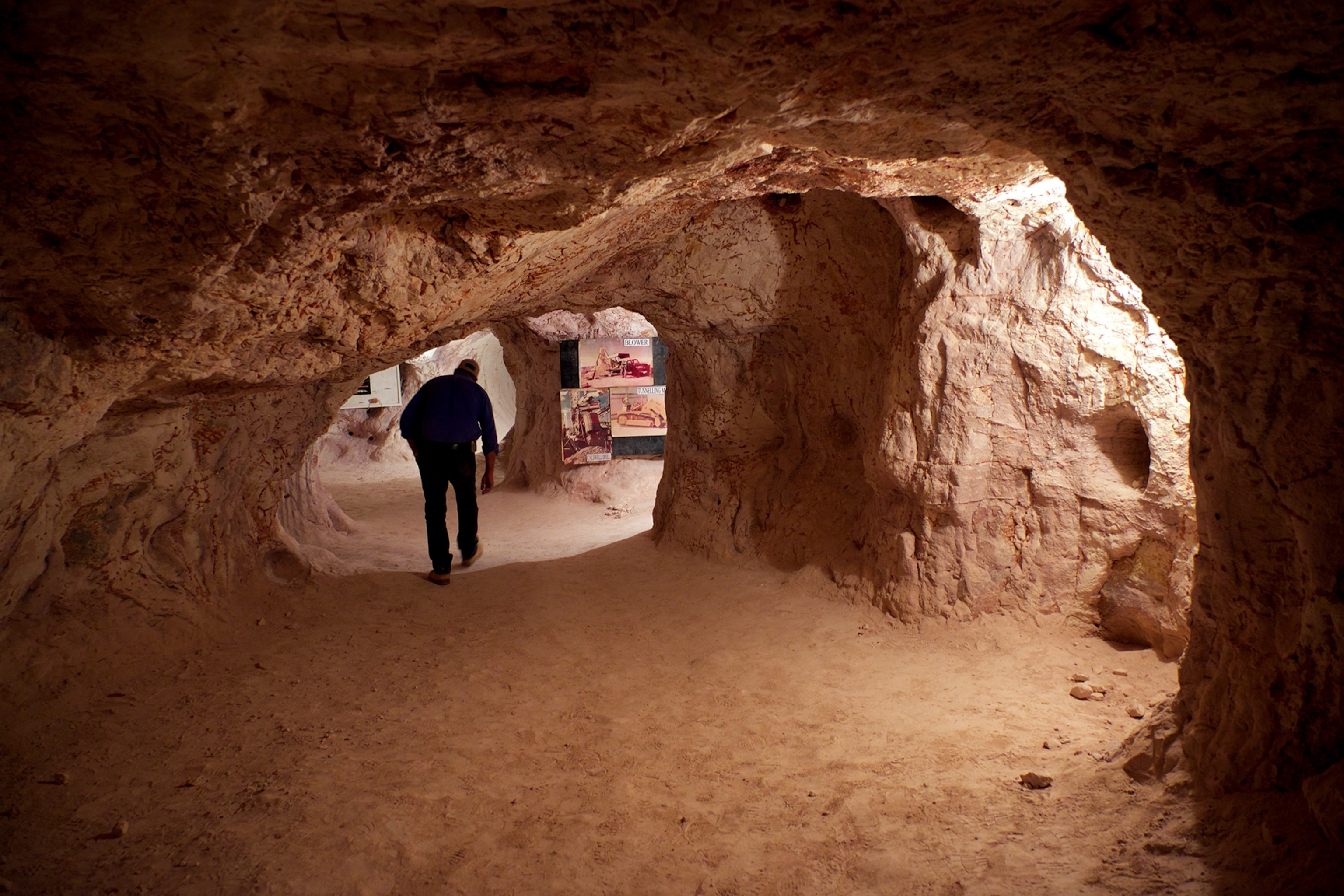 a man walking through the Opal Cave in Coober Pedy, South Australia