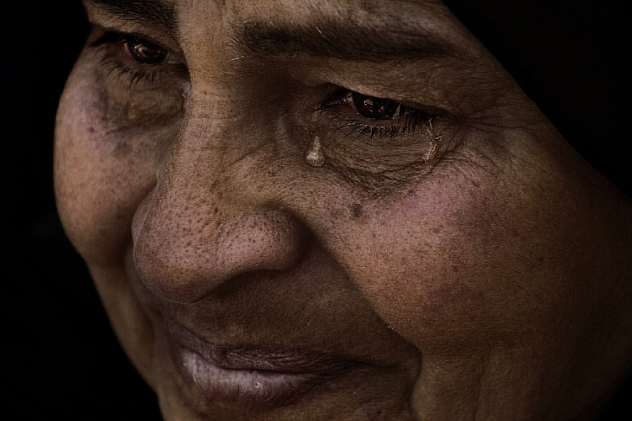Picture an Egyptian woman in mourning for her son