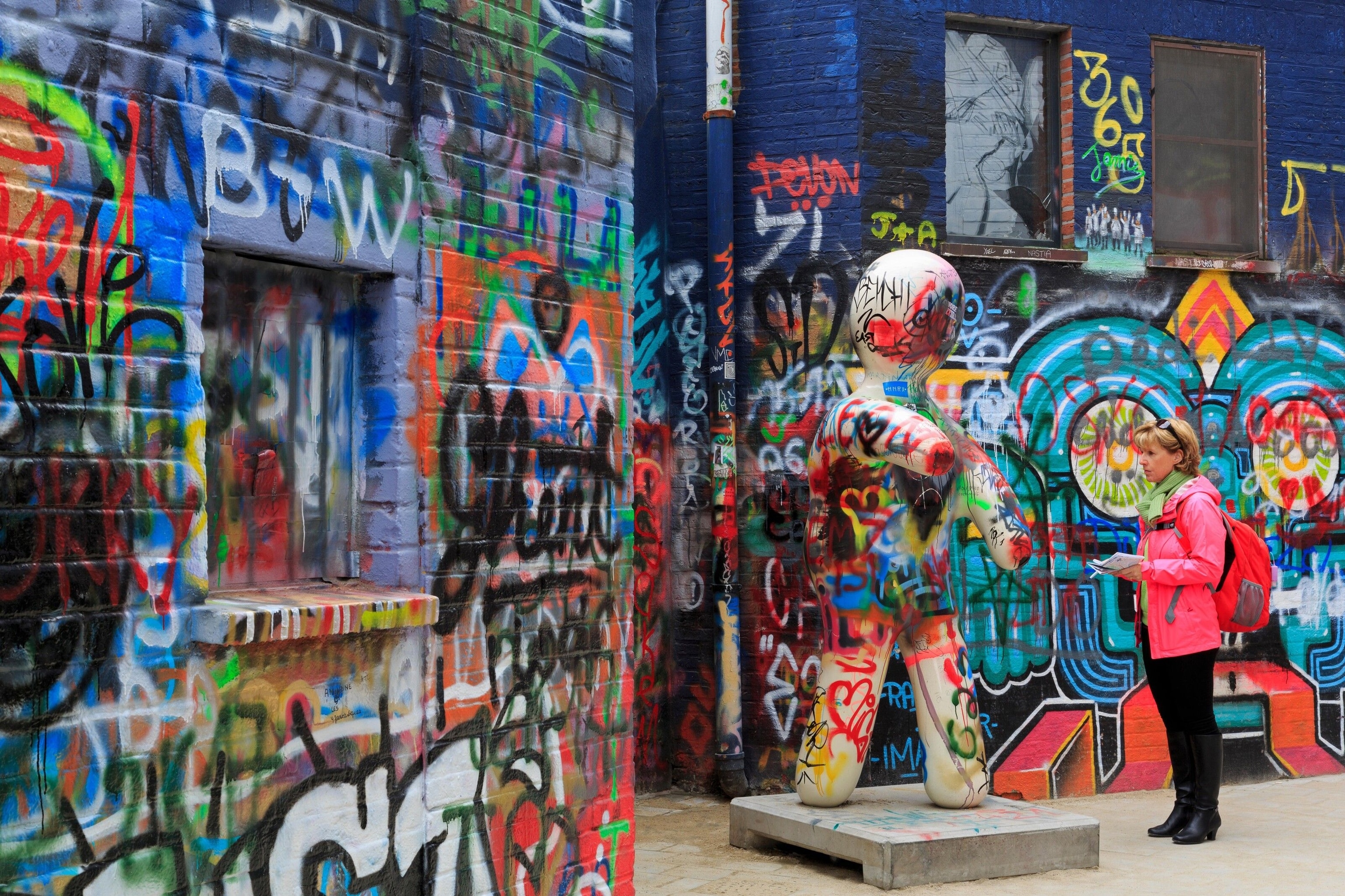 Ghent's Graffiti Street is covered in spray paint signatures and swirling street art, in a multitude of colours.