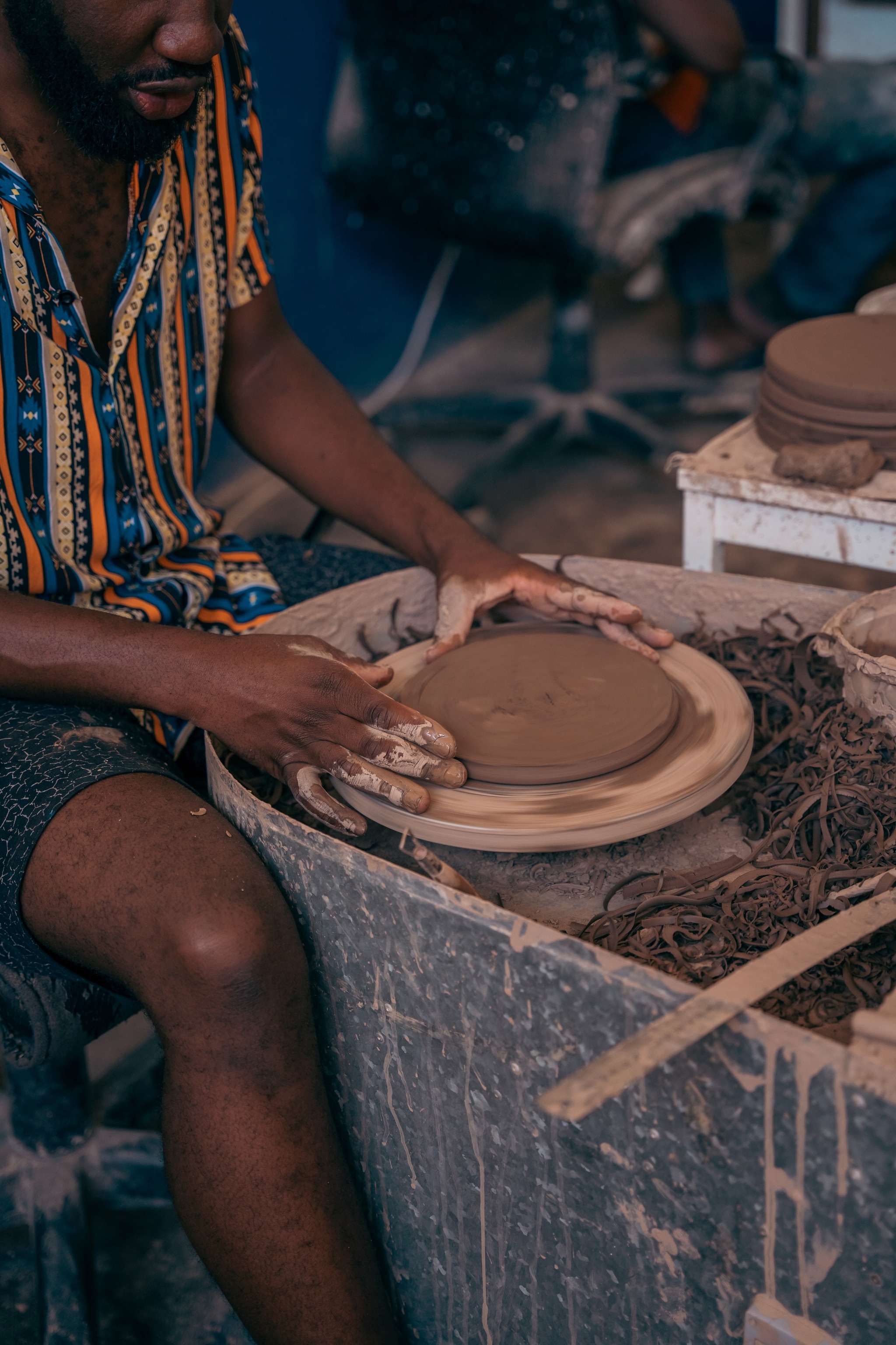 person on a pottery wheel