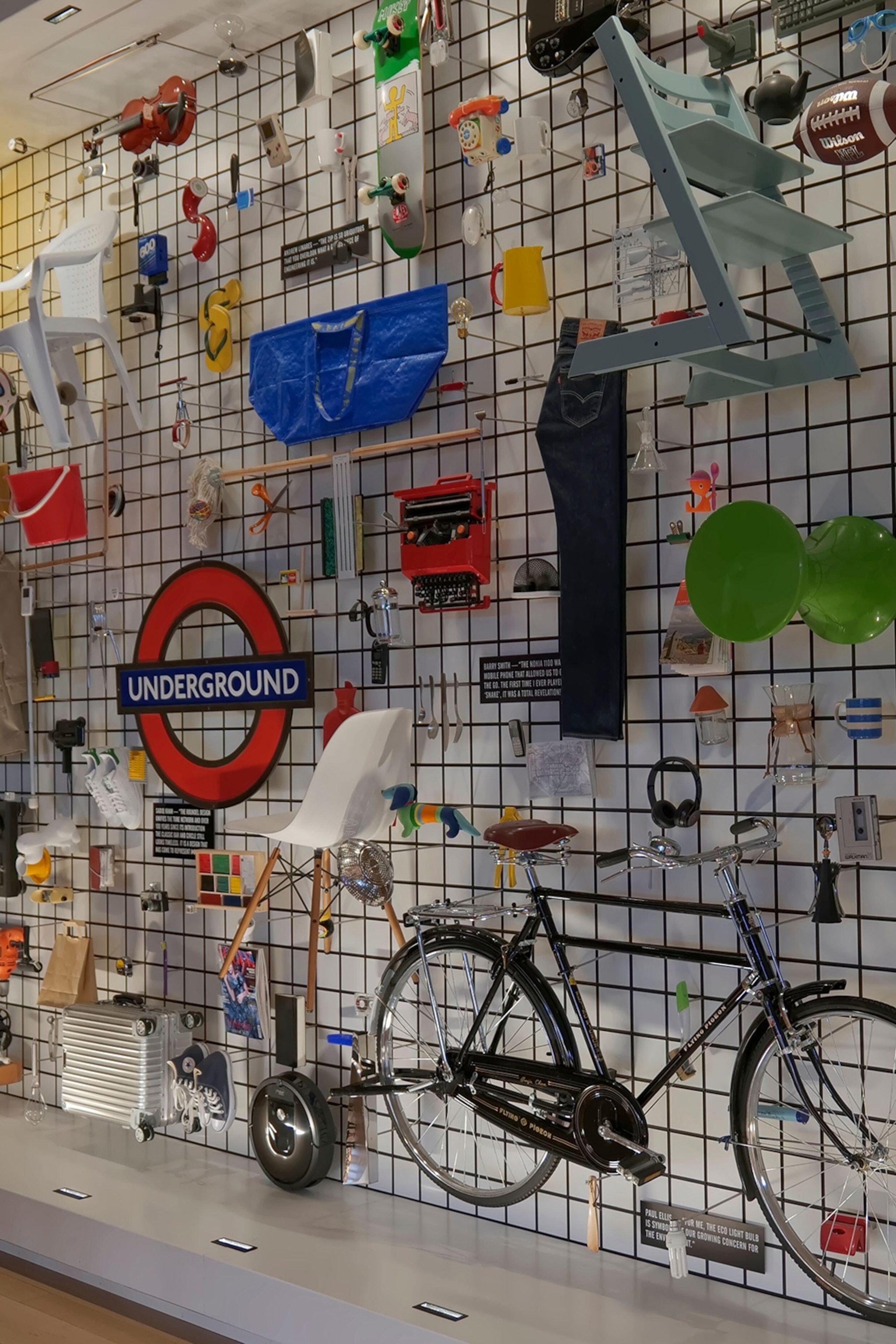 A pin wall with different objects, including a bike, a tube sign and an IKEA bag.