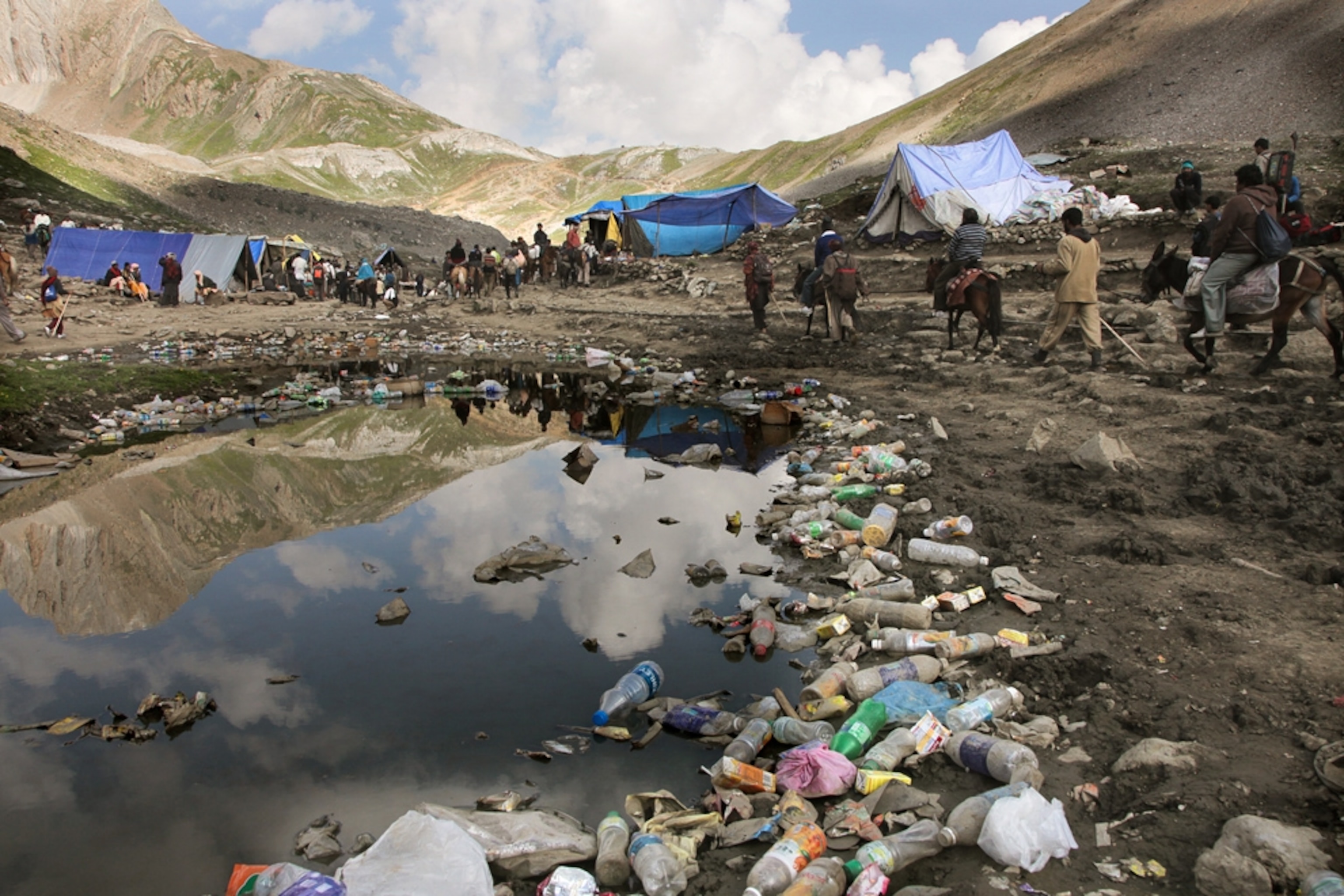 Garbage in a lake along the Amarnath pilgrimage in Kashmir, India