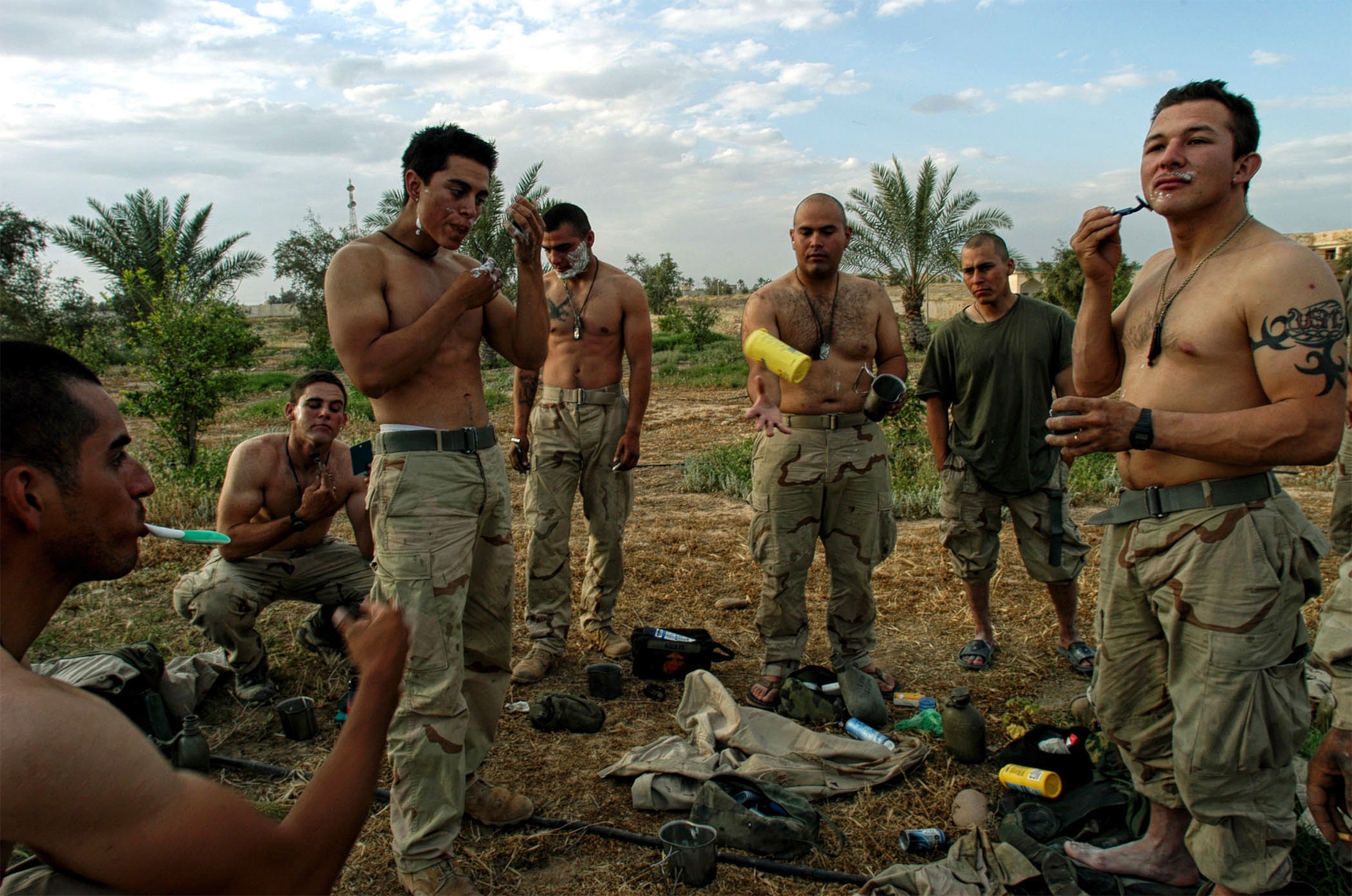 U.S. Marines taking a break to shave in front of one of Saddam Hussain's palaces in Iraq