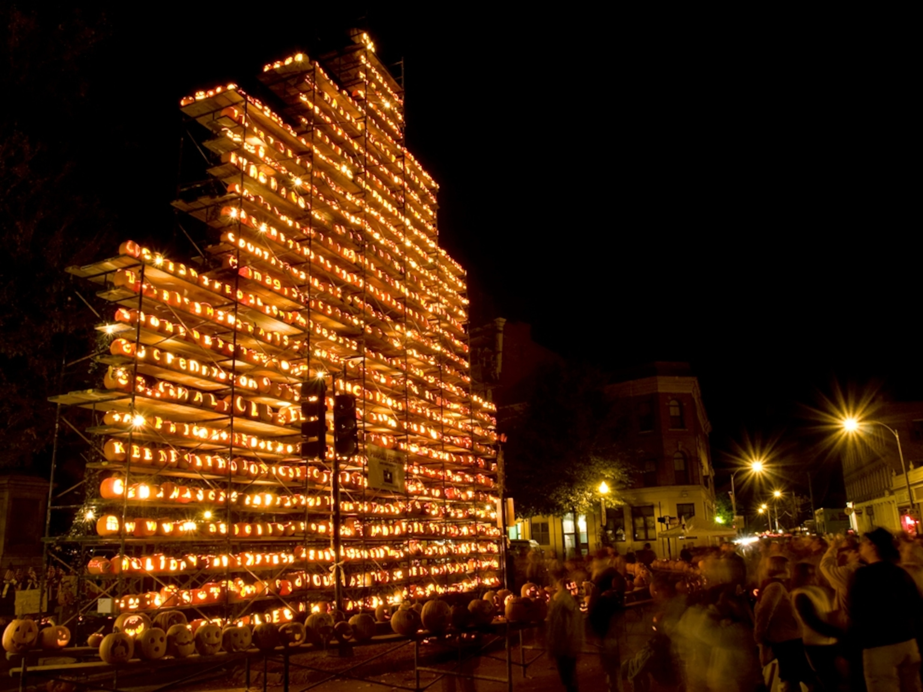 a tower of glowing jack-o'-lanterns