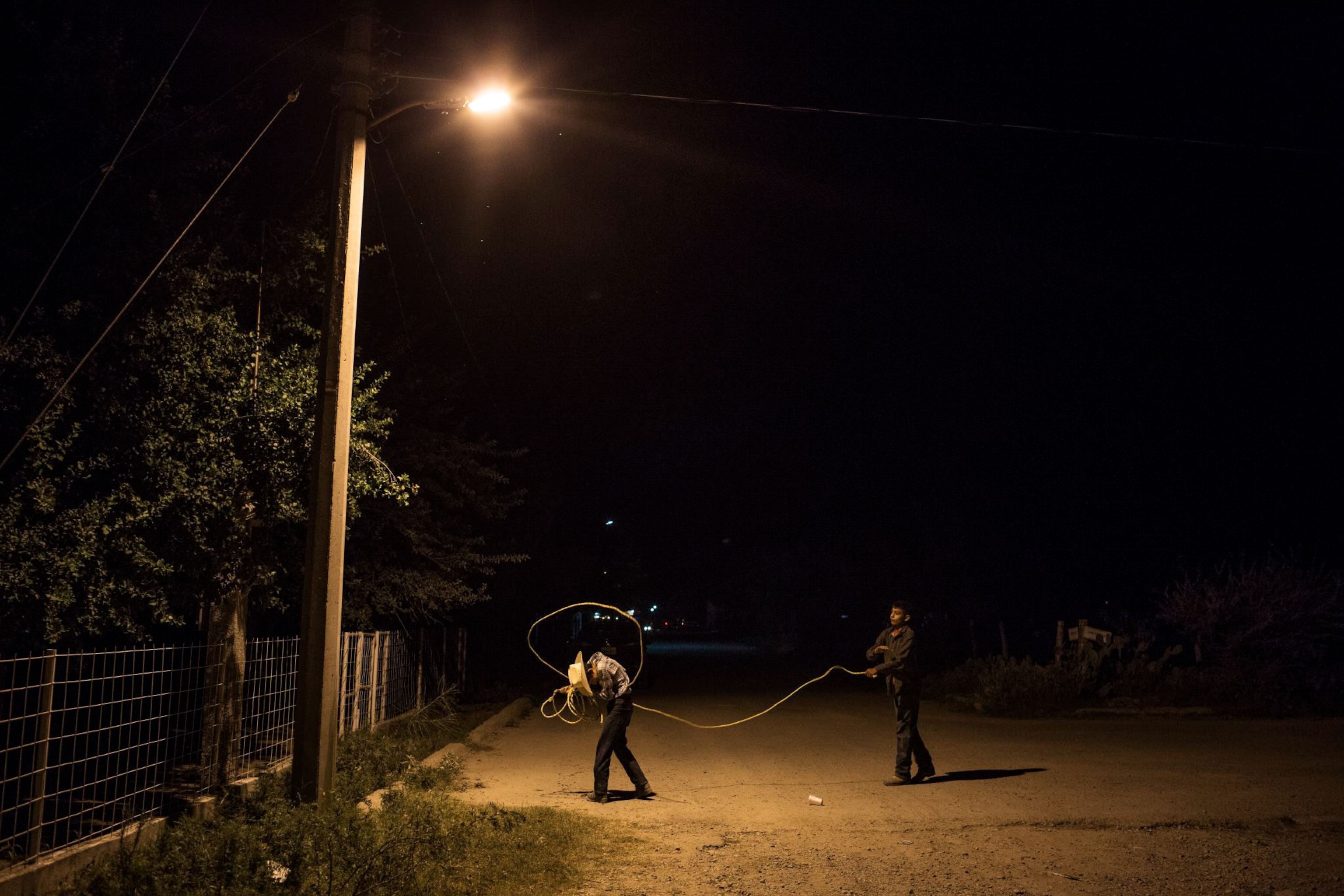 boys playing with a lasso in Mexico